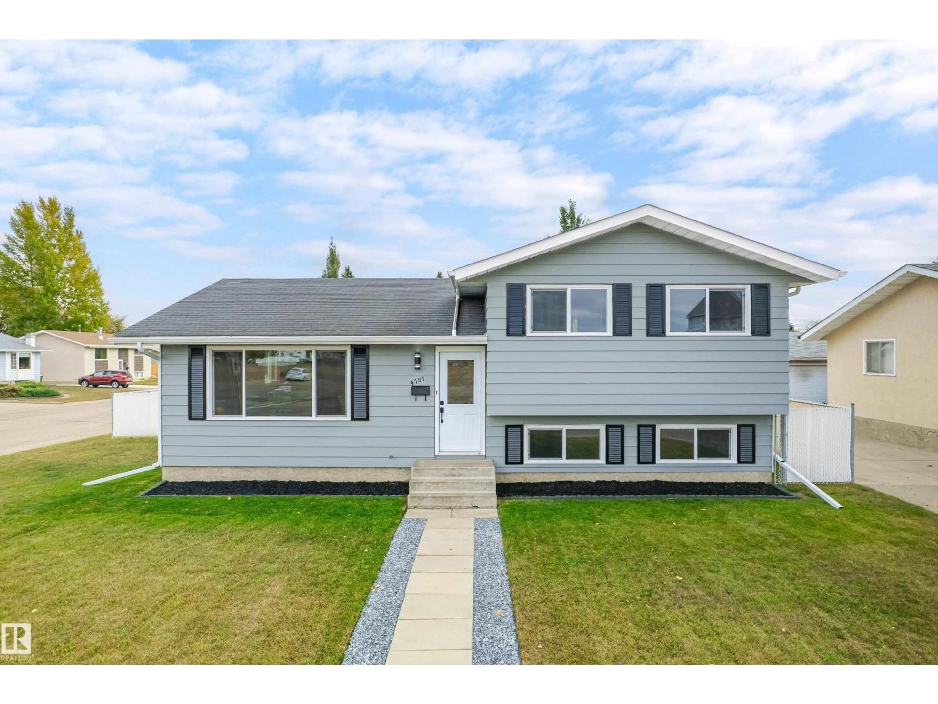 Home with vinyl exterior material, street for 9701 100, Morinville Alberta T8R1G6