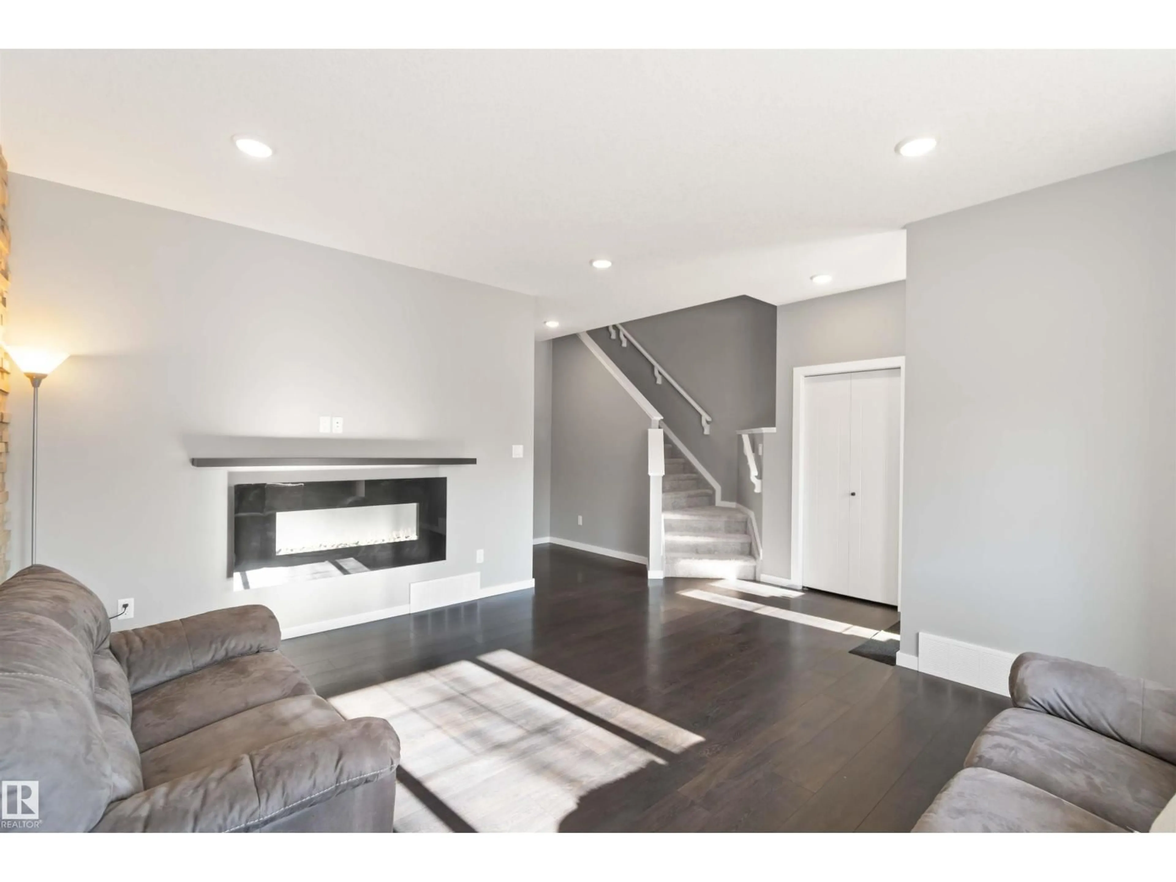 Living room with furniture, wood/laminate floor for 2122 GLENRIDDING WY, Edmonton Alberta T6W2H4