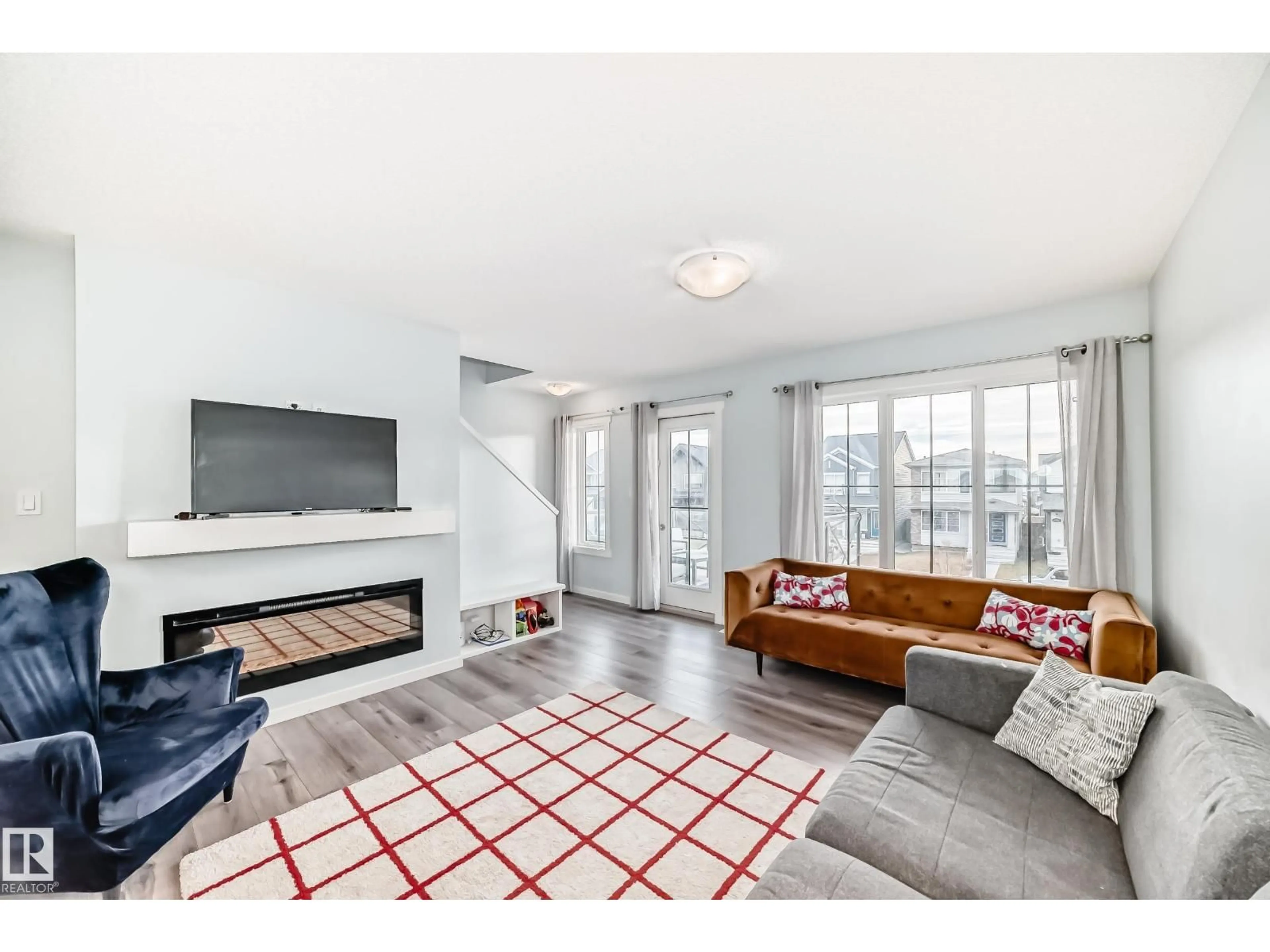 Living room with furniture, unknown for 19312 27 AV, Edmonton Alberta T6M1K9