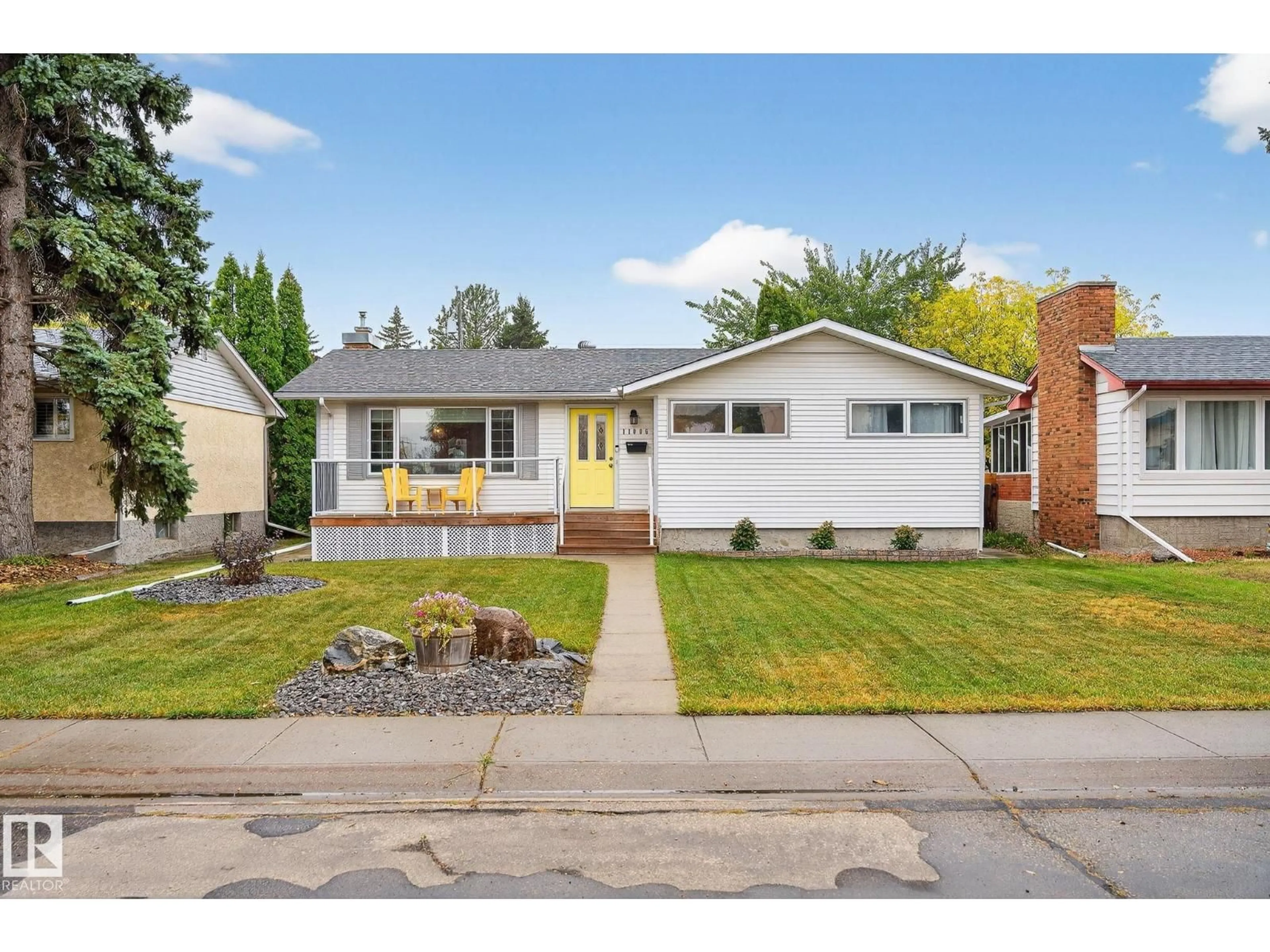 Home with vinyl exterior material, street for NW - 11006 154 ST, Edmonton Alberta T5P2K1