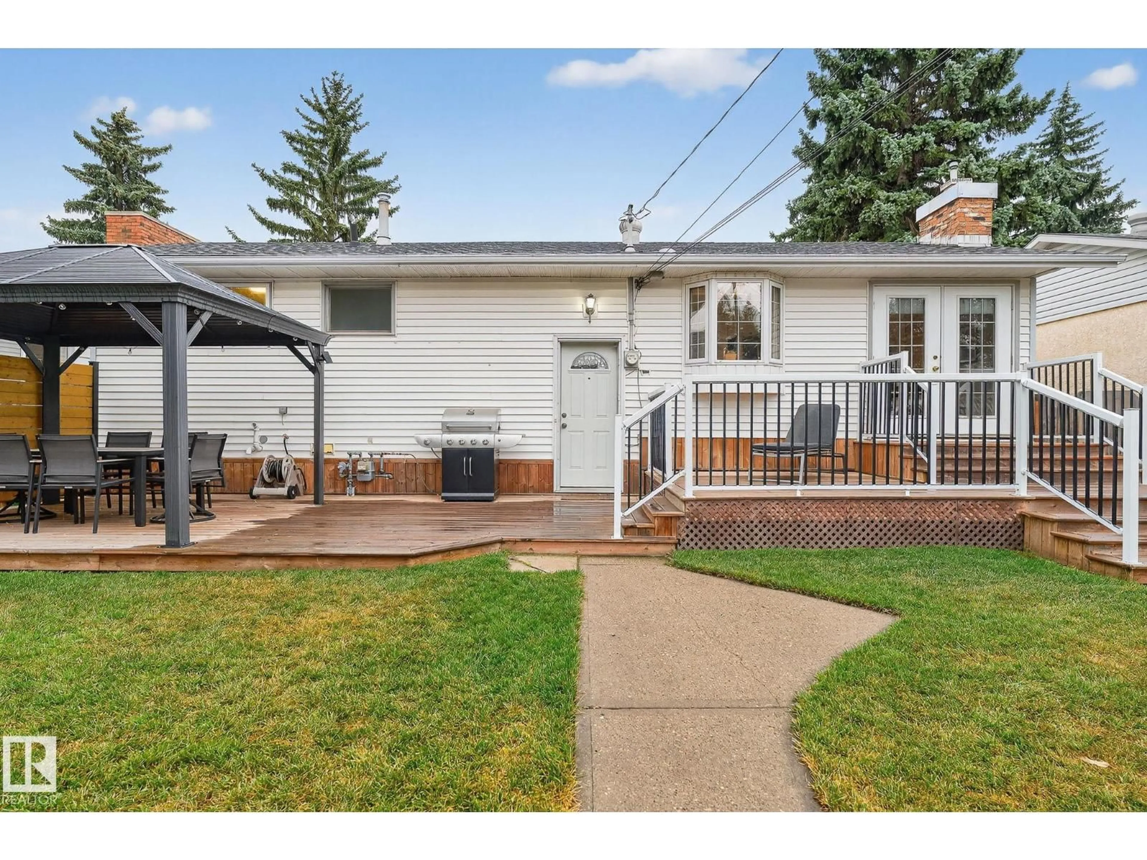 Home with vinyl exterior material, street for NW - 11006 154 ST, Edmonton Alberta T5P2K1