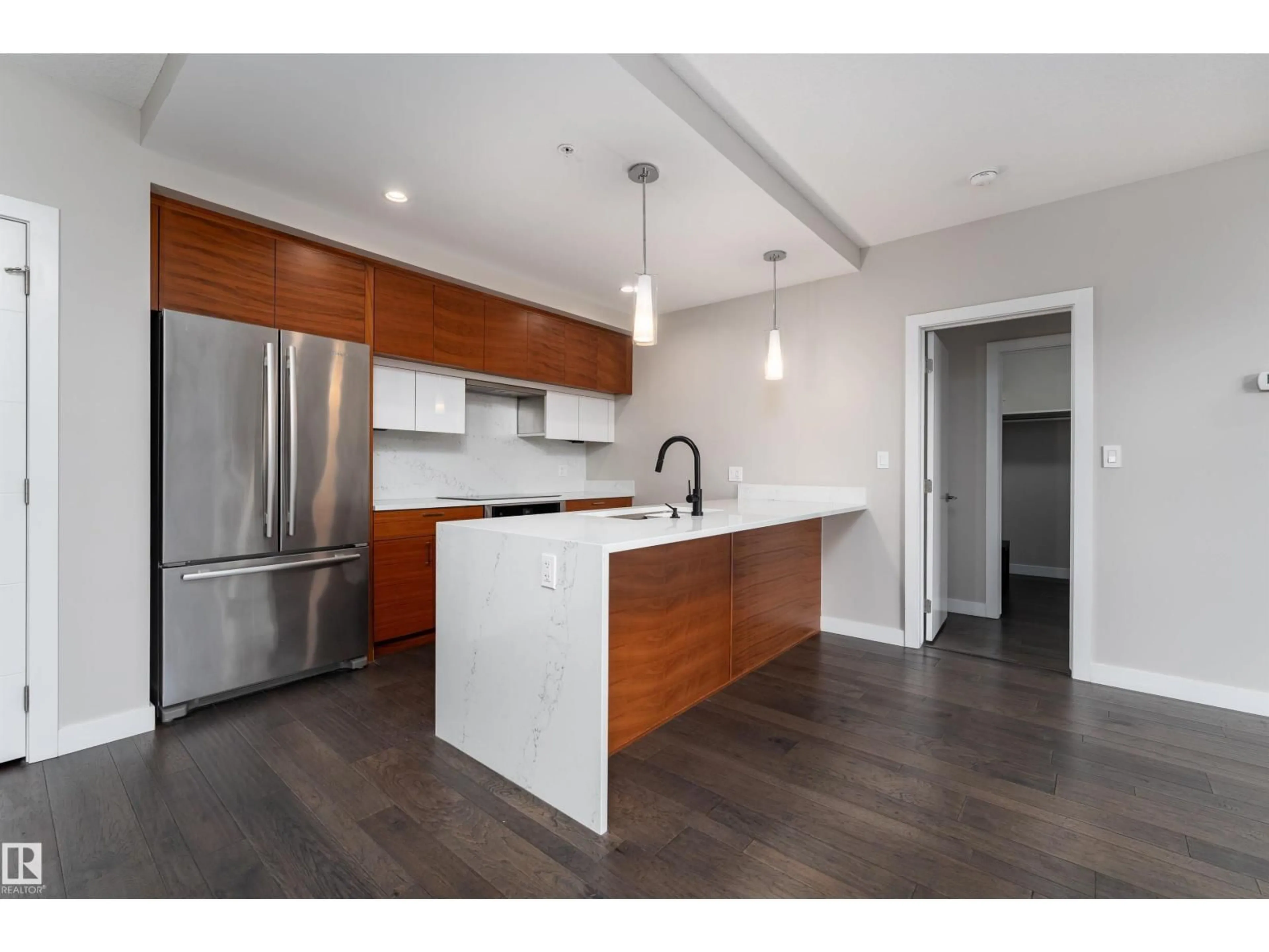 Open concept kitchen, wood/laminate floor for #204 - 11710 87 AV, Edmonton Alberta T6G0Y3