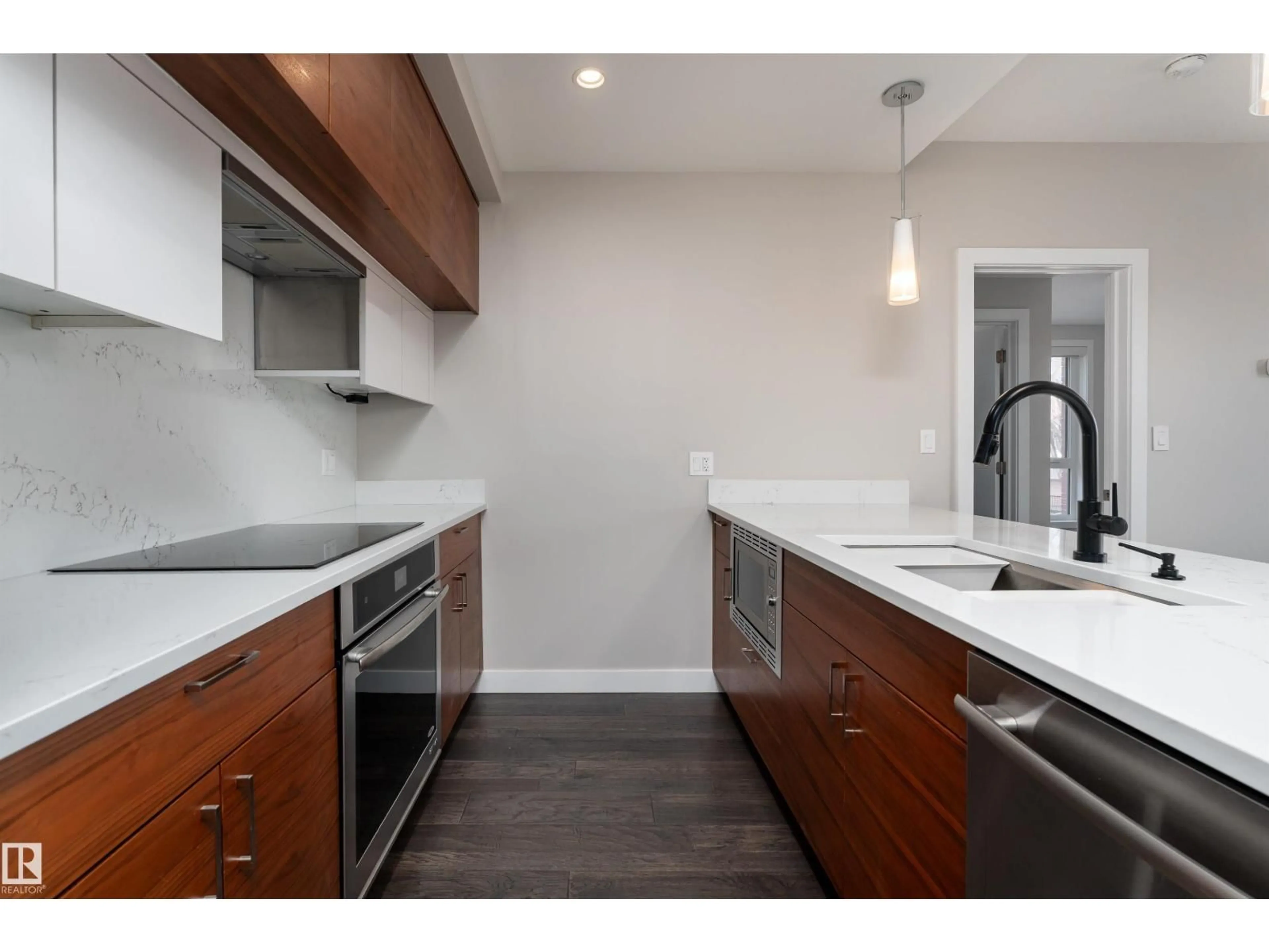 Open concept kitchen, wood/laminate floor for #204 - 11710 87 AV, Edmonton Alberta T6G0Y3