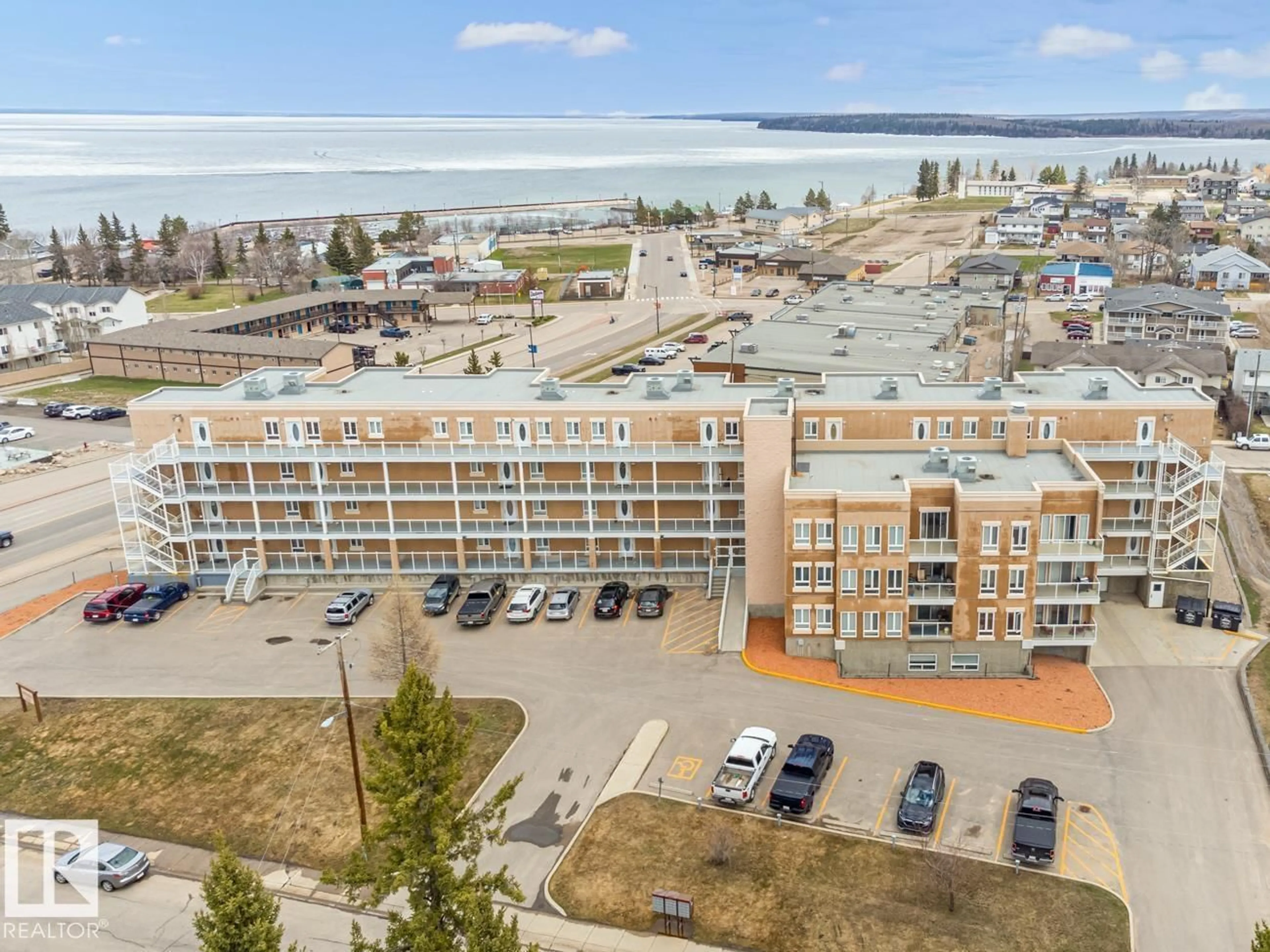 A pic from outside/outdoor area/front of a property/back of a property/a pic from drone, water/lake/river/ocean view for 204 - 802 12 ST, Cold Lake Alberta T9M0A7