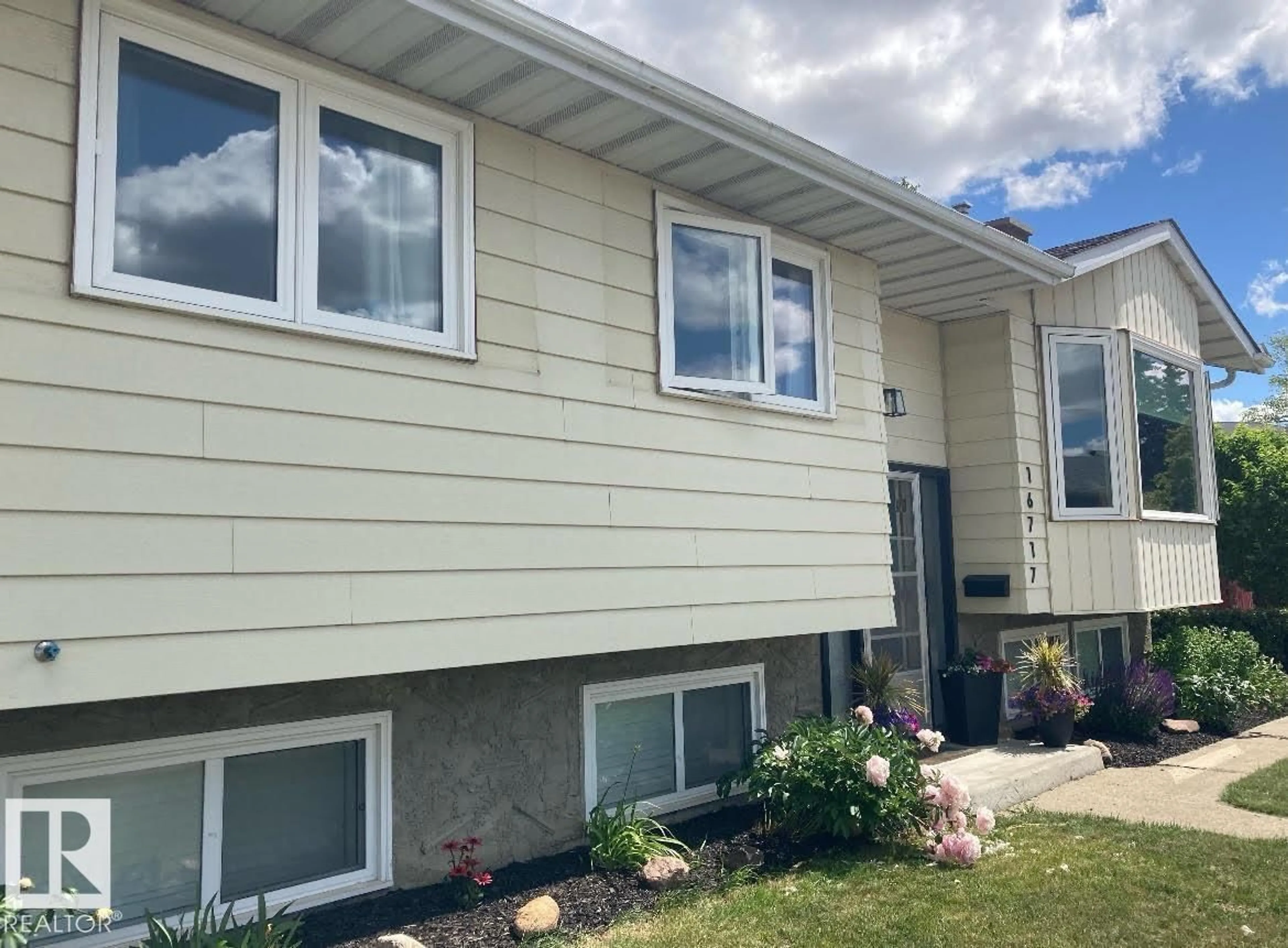 Home with vinyl exterior material, street for 16717 109A ST NW, Edmonton Alberta T5X2T7