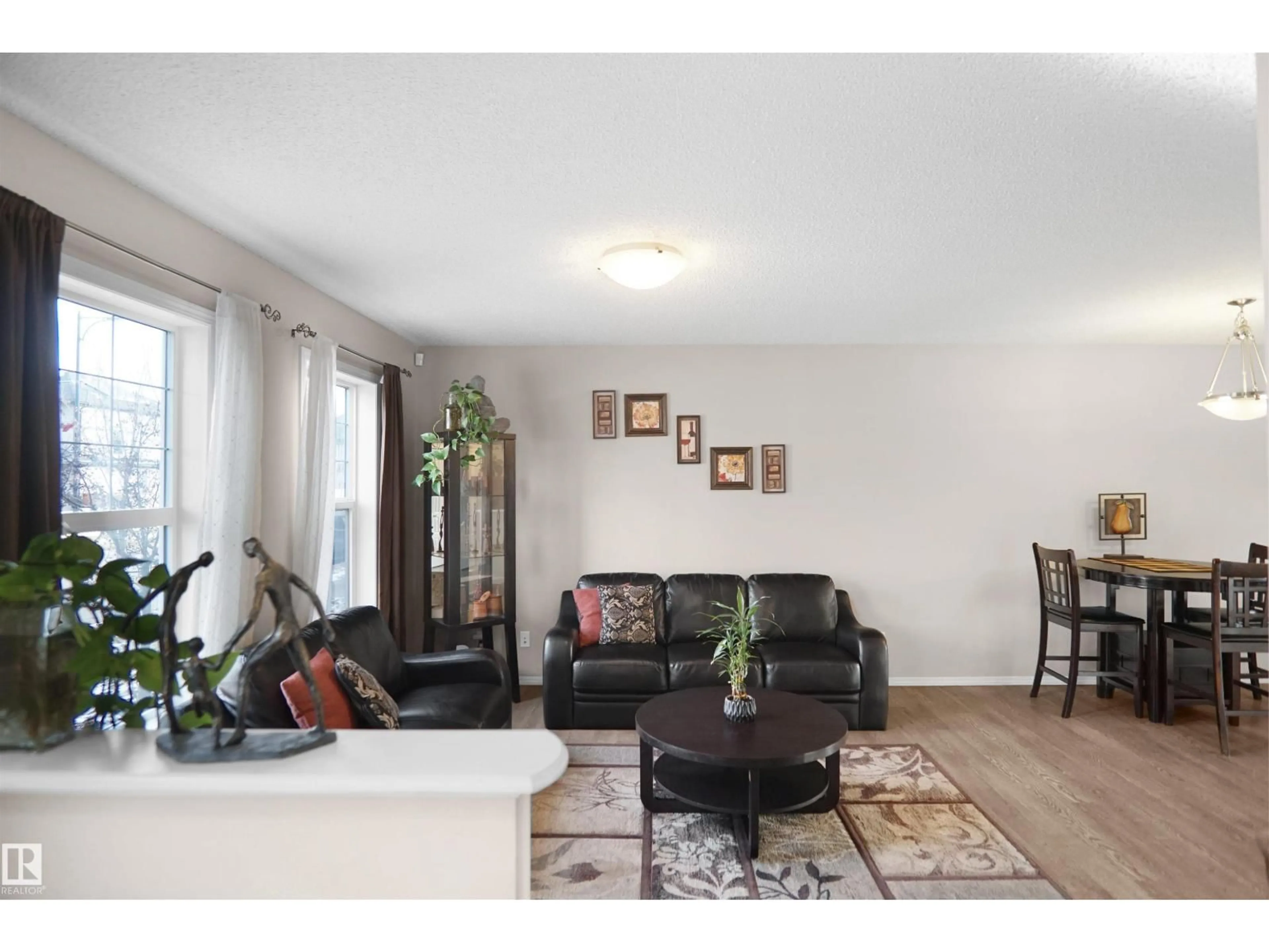 Living room with furniture, wood/laminate floor for 287 ALLARD BV, Edmonton Alberta T6W3H5