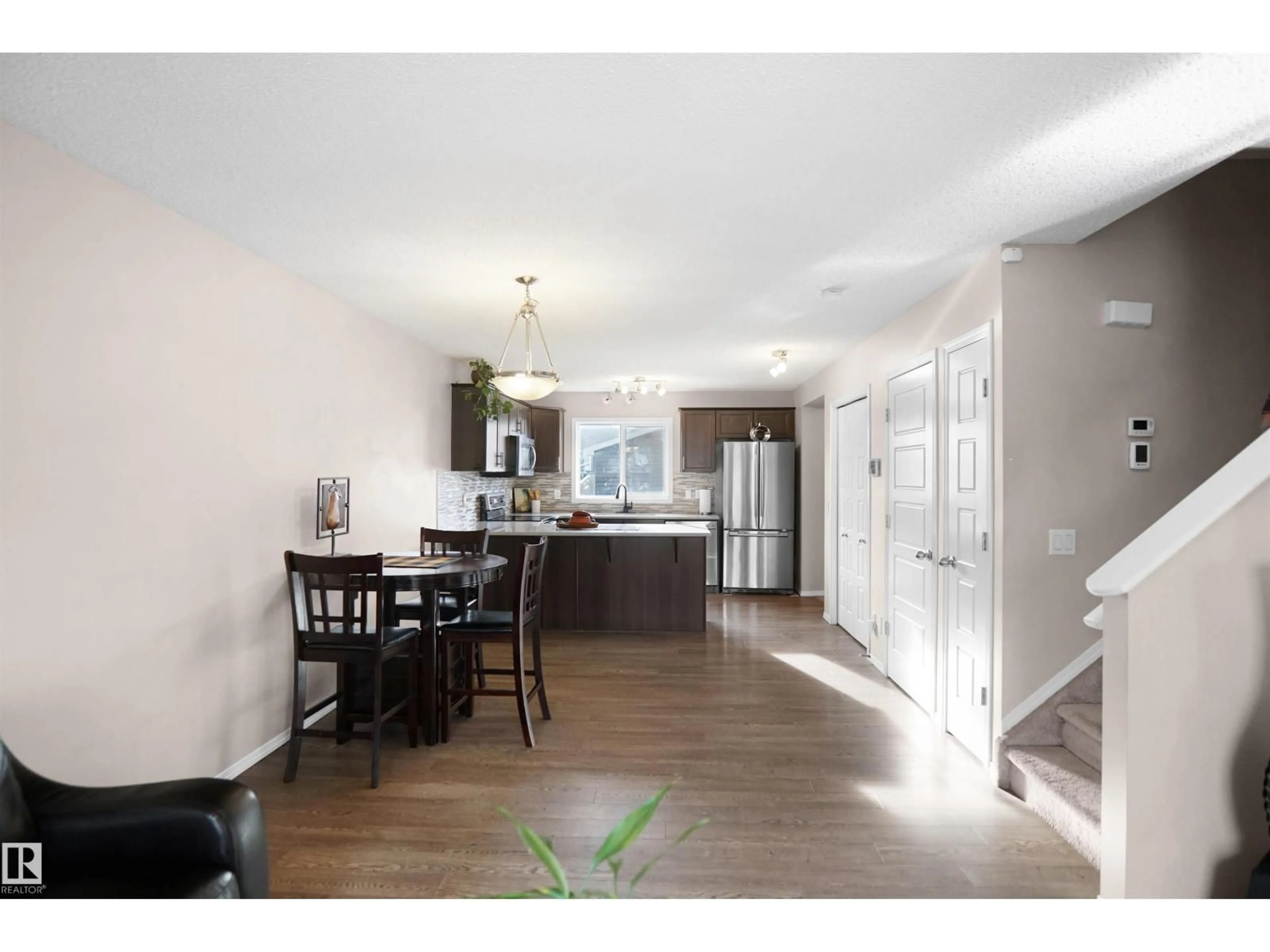 Open concept kitchen, wood/laminate floor for 287 ALLARD BV, Edmonton Alberta T6W3H5