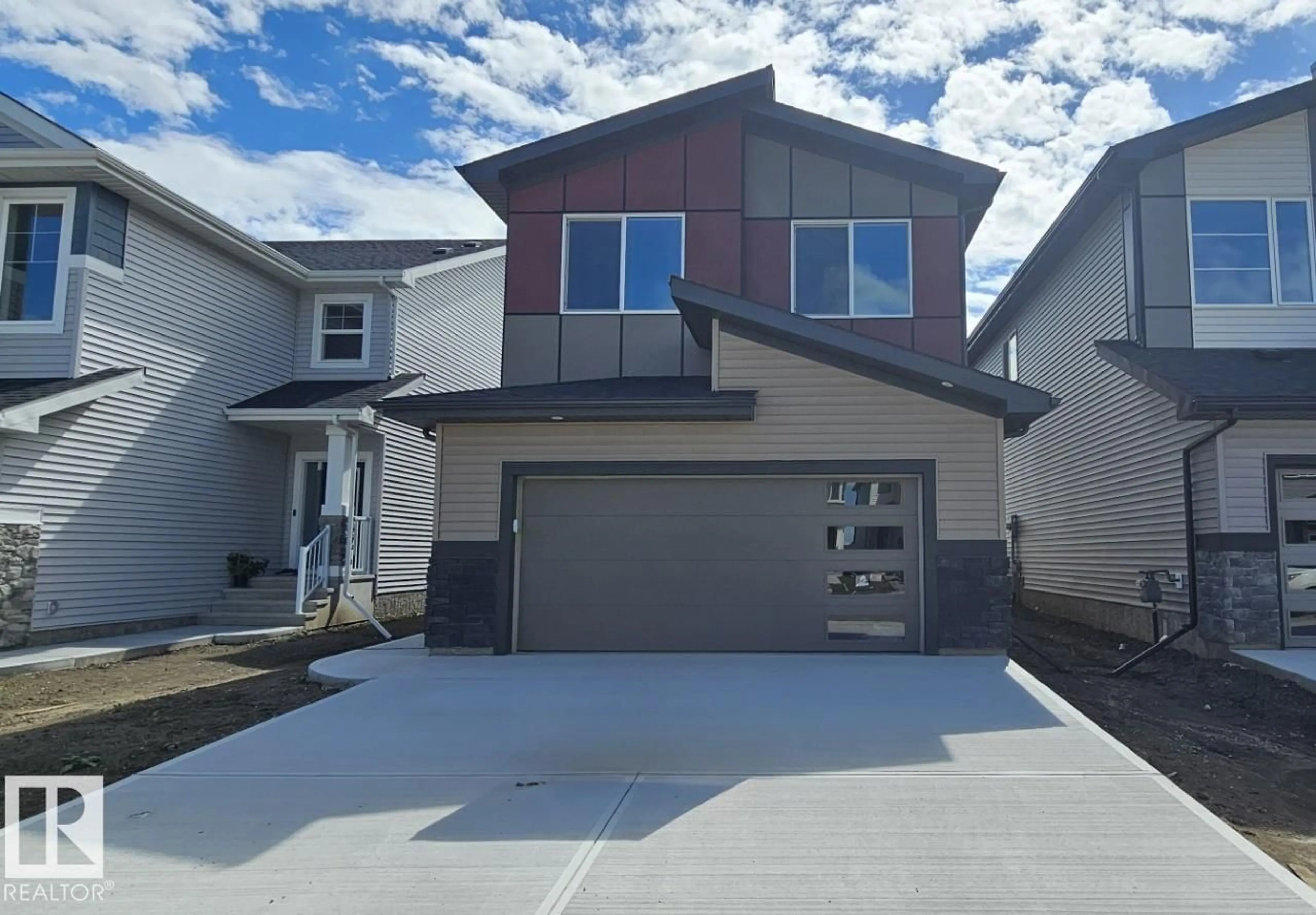 Home with vinyl exterior material, street for 7207 182 AV, Edmonton Alberta T5Z0J1