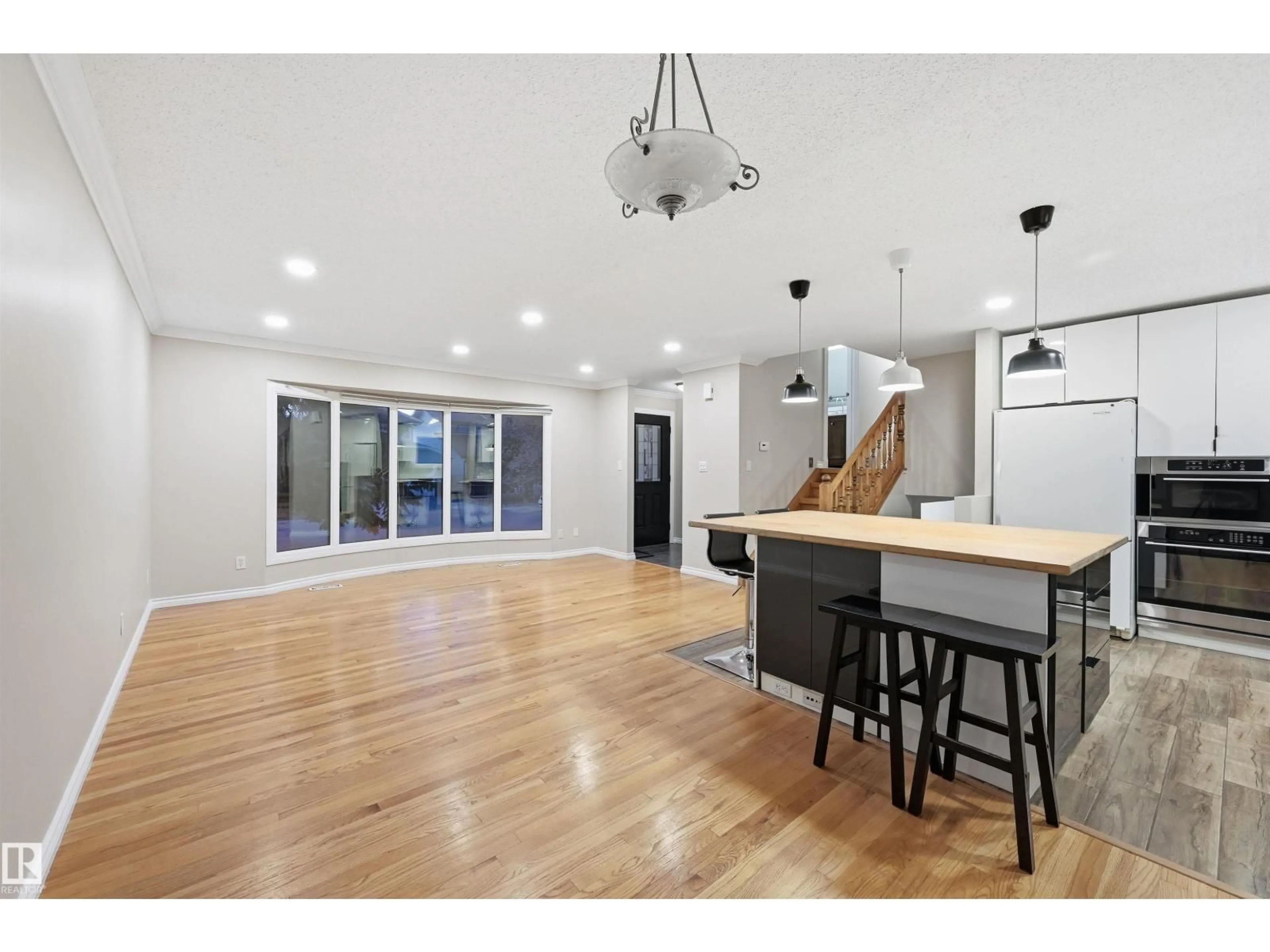 Open concept kitchen, wood/laminate floor for 16803 93 ST, Edmonton Alberta T5Z1W9