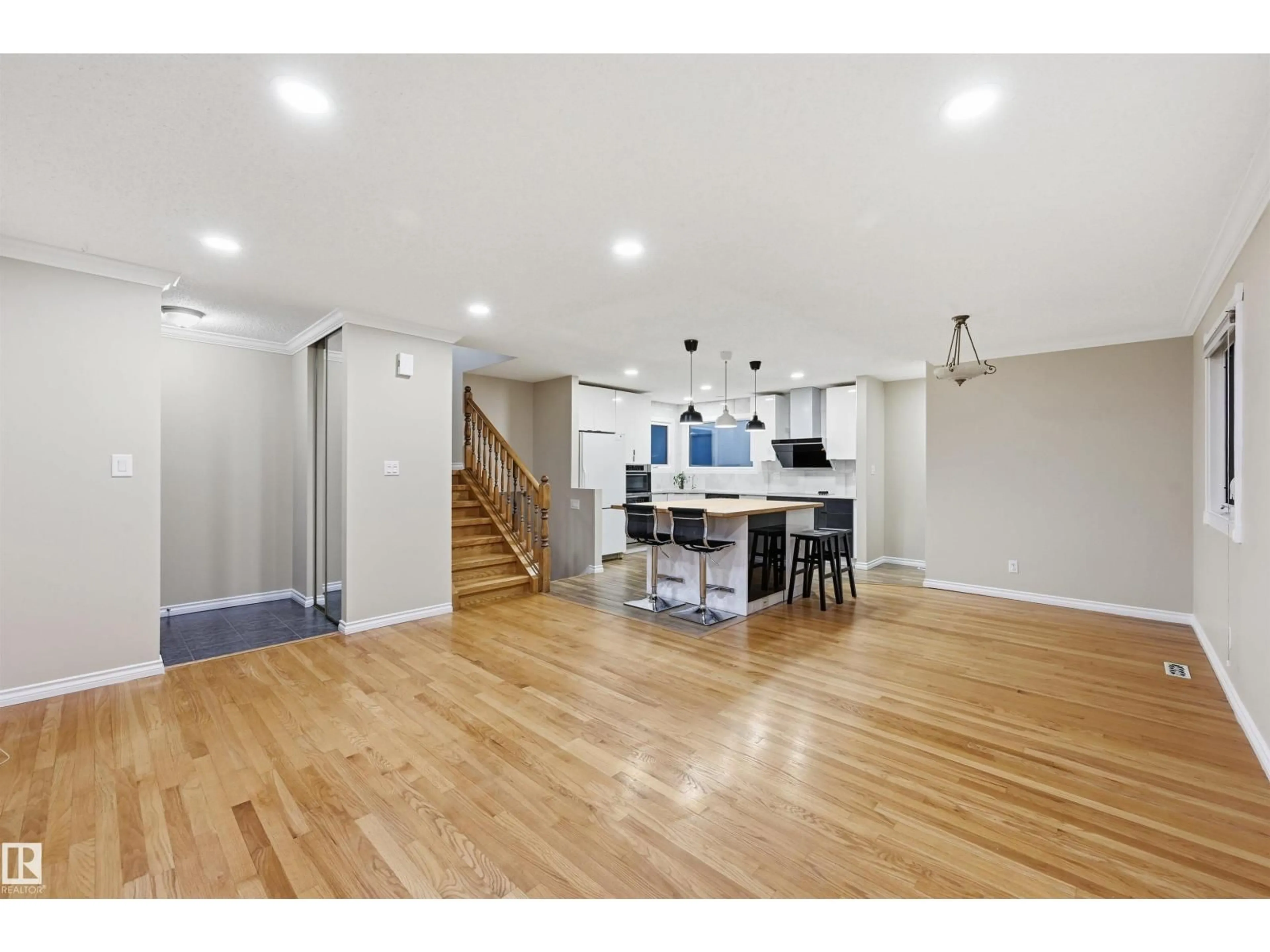 Open concept kitchen, wood/laminate floor for 16803 93 ST, Edmonton Alberta T5Z1W9