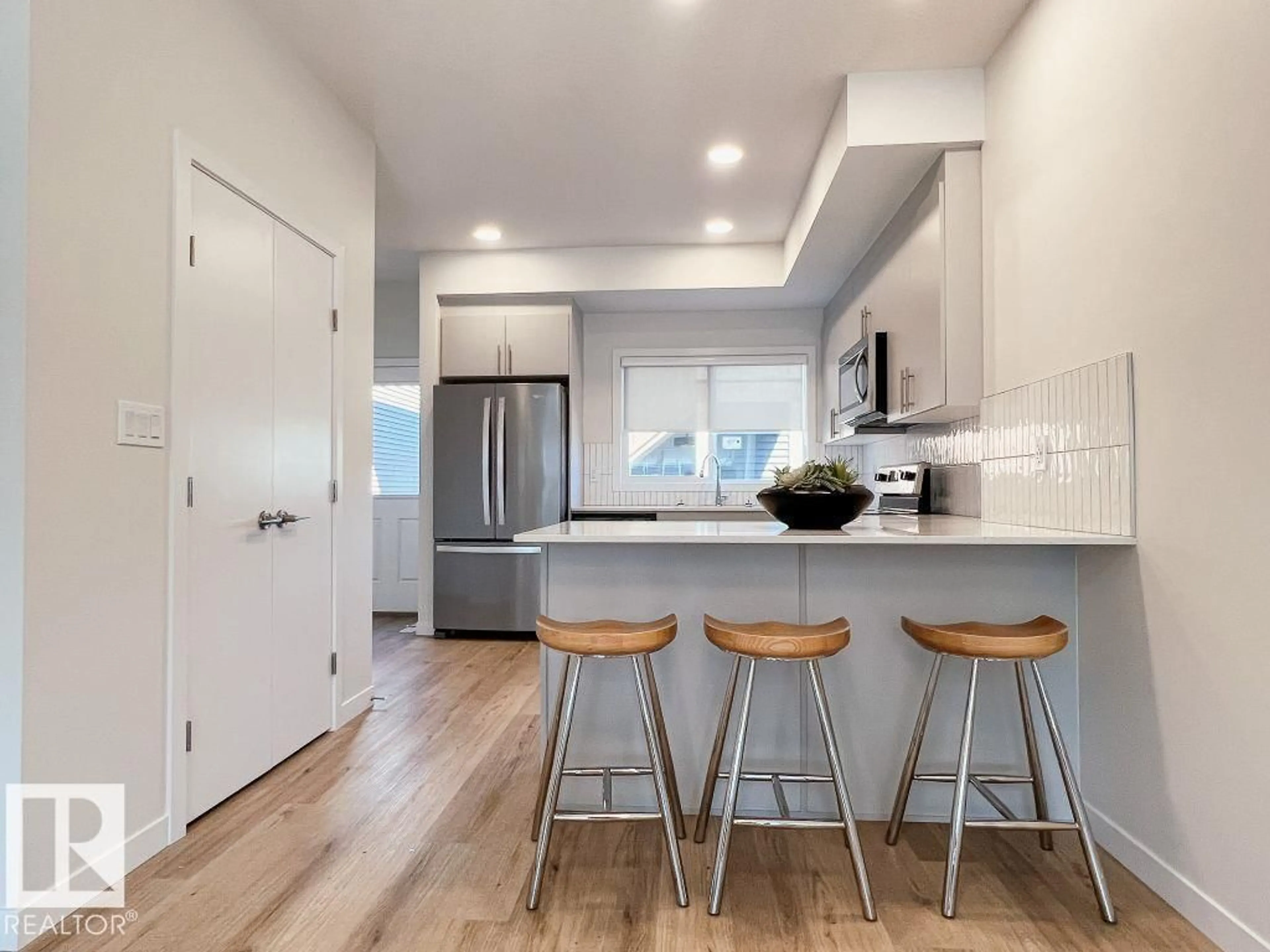 Open concept kitchen, wood/laminate floor for 120 GARNEAU GA, Spruce Grove Alberta T7X2Y6