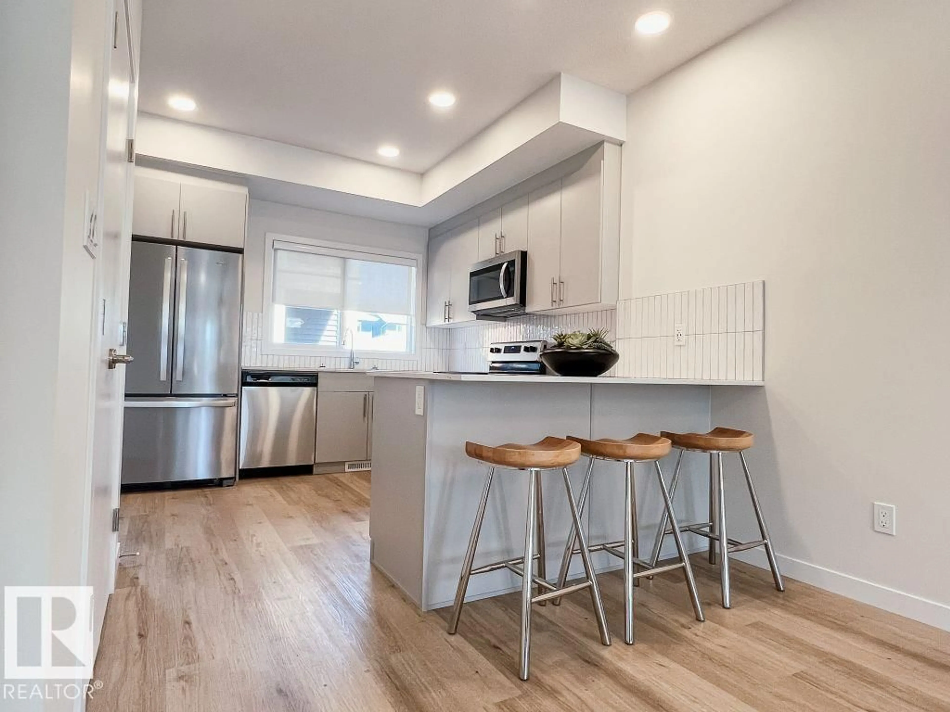 Open concept kitchen, wood/laminate floor for 120 GARNEAU GA, Spruce Grove Alberta T7X2Y6