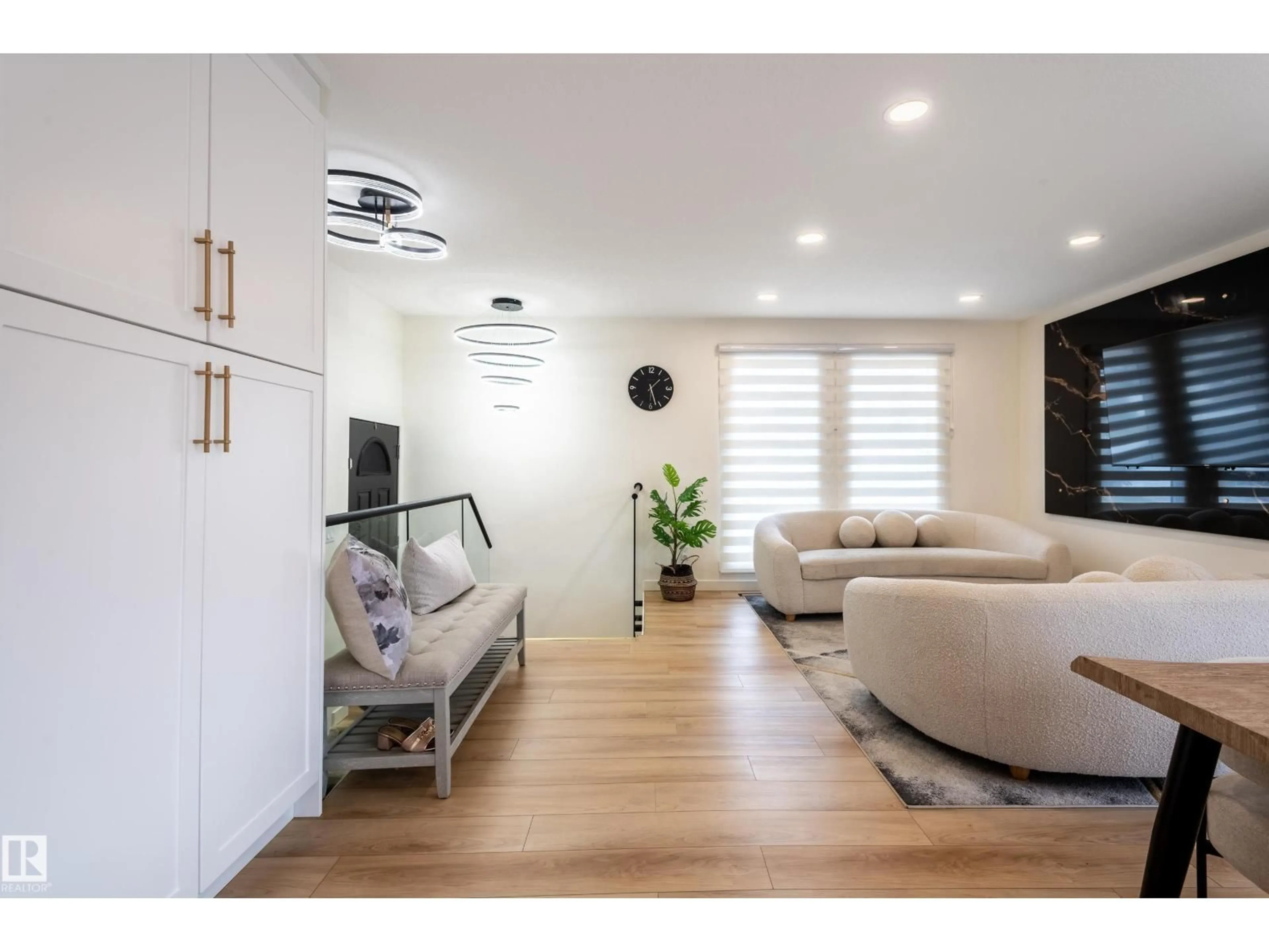 Living room with furniture, wood/laminate floor for NW - 17327 106 ST, Edmonton Alberta T5X3W9