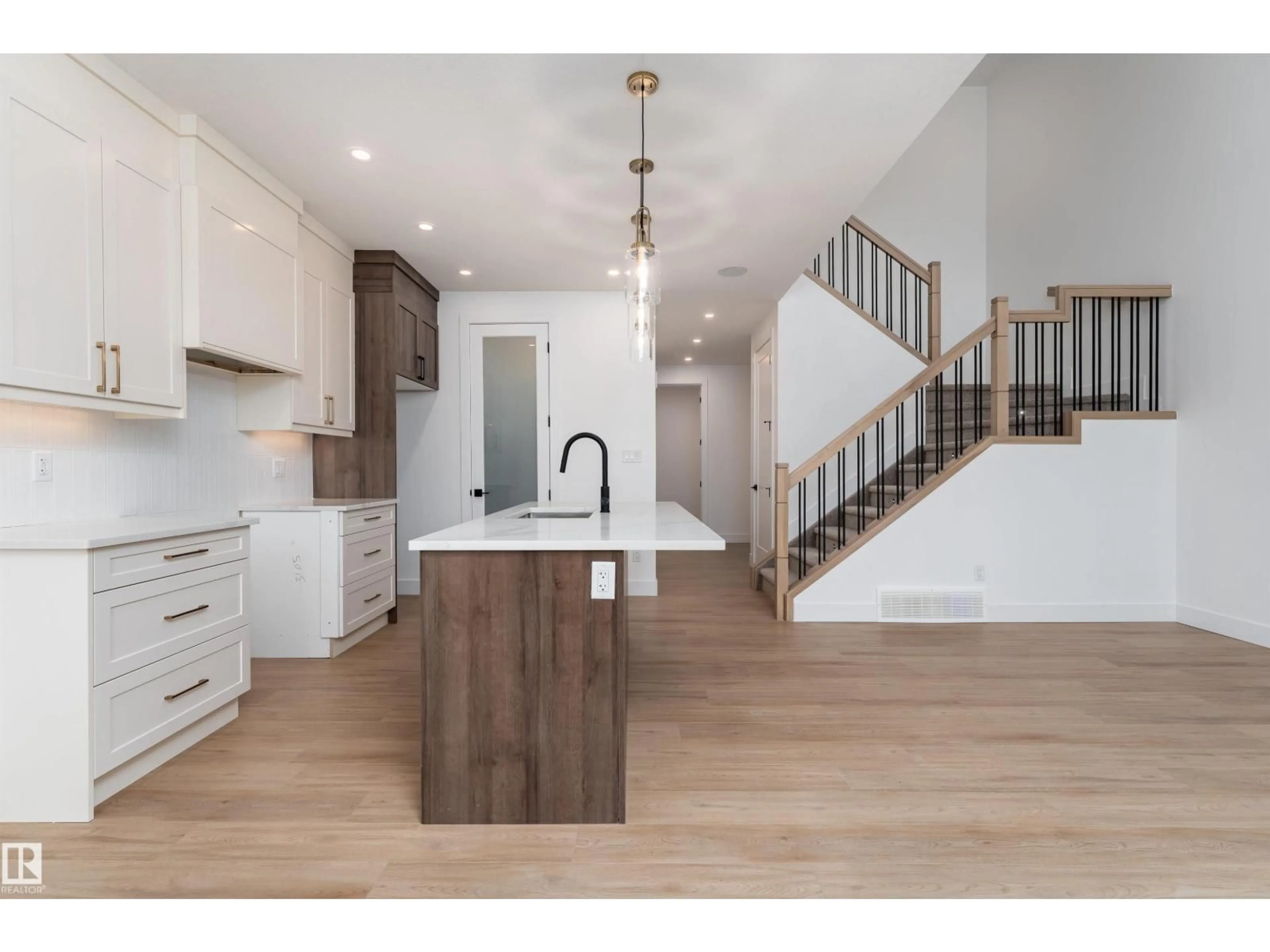 Open concept kitchen, wood/laminate floor for 3105 MAGPIE WY, Edmonton Alberta T5S0V3