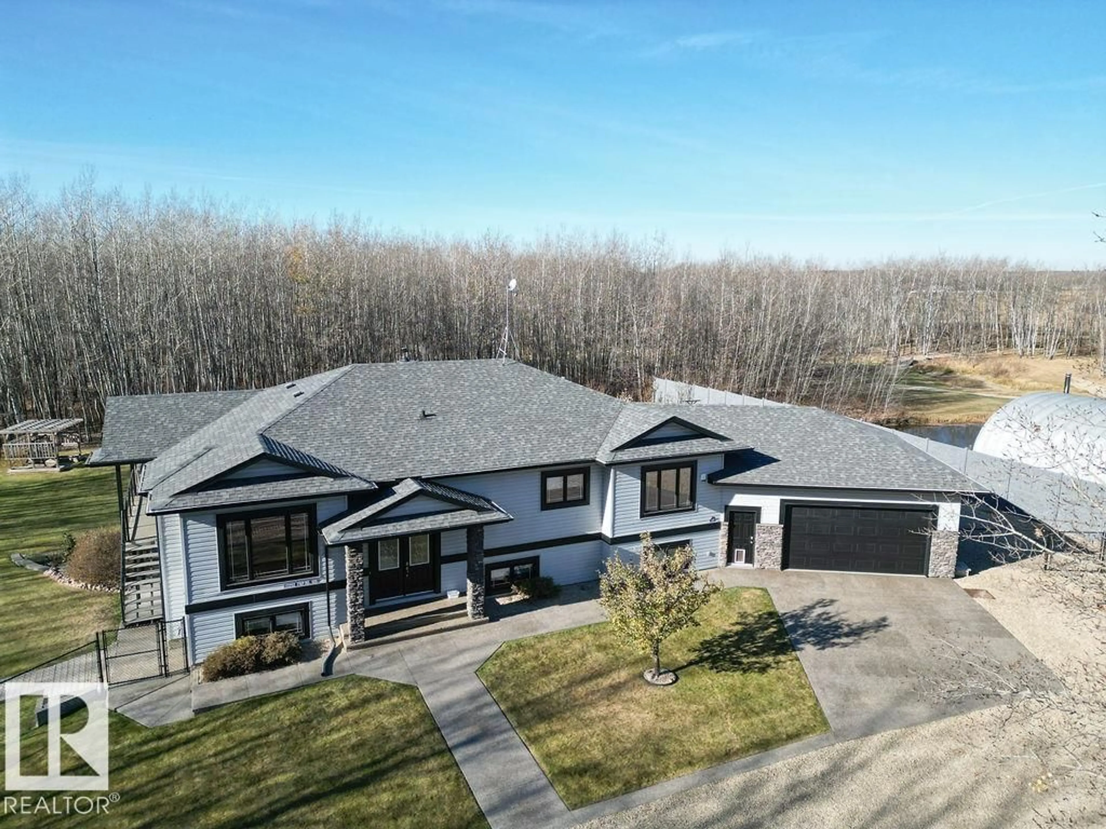 A pic from outside/outdoor area/front of a property/back of a property/a pic from drone, unknown for 22252 TOWNSHIP ROAD 505, Rural Leduc County Alberta T0B3M2