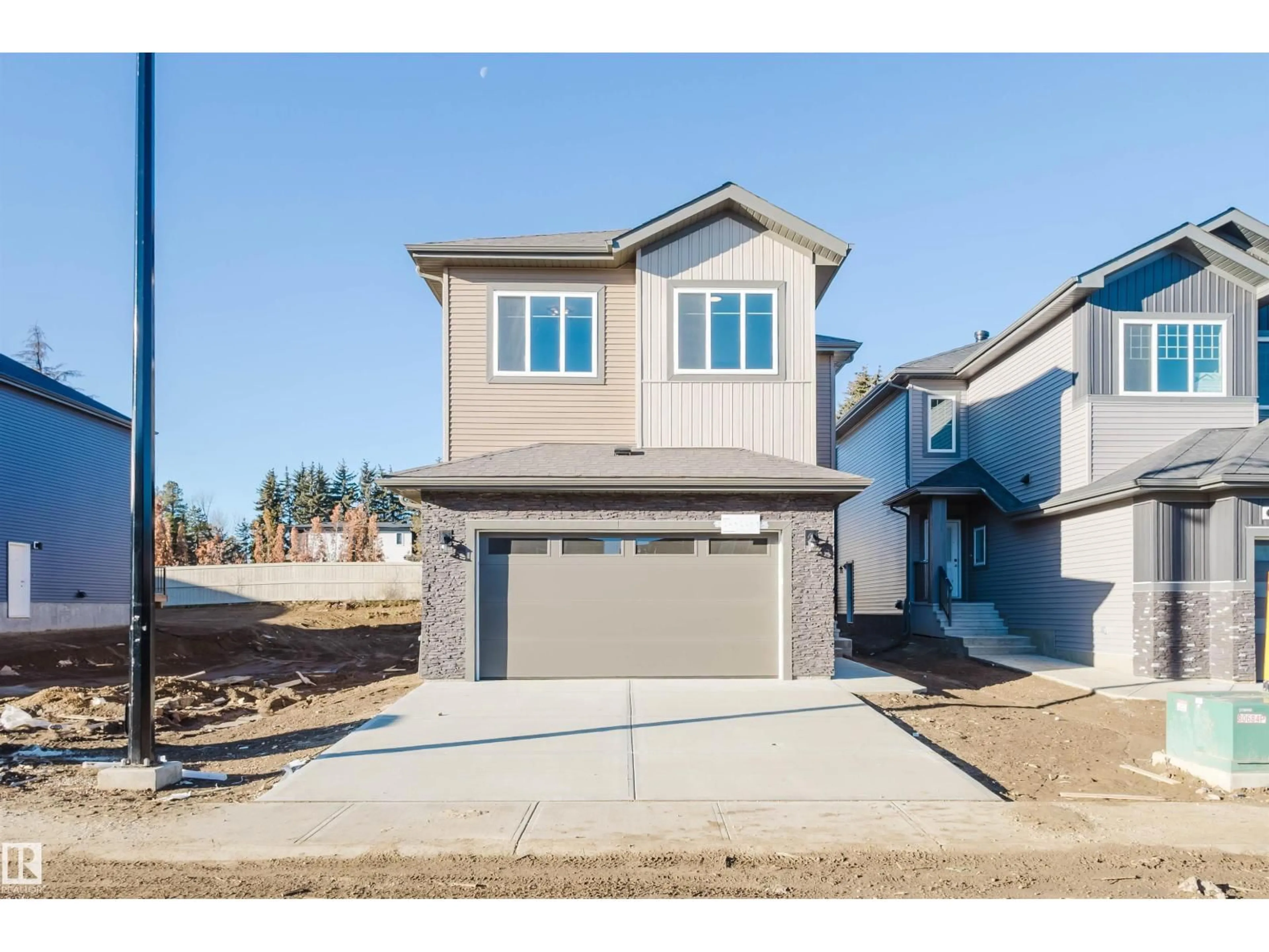 Home with vinyl exterior material, street for NW - 1570 SISKIN LI, Edmonton Alberta T5S0V1