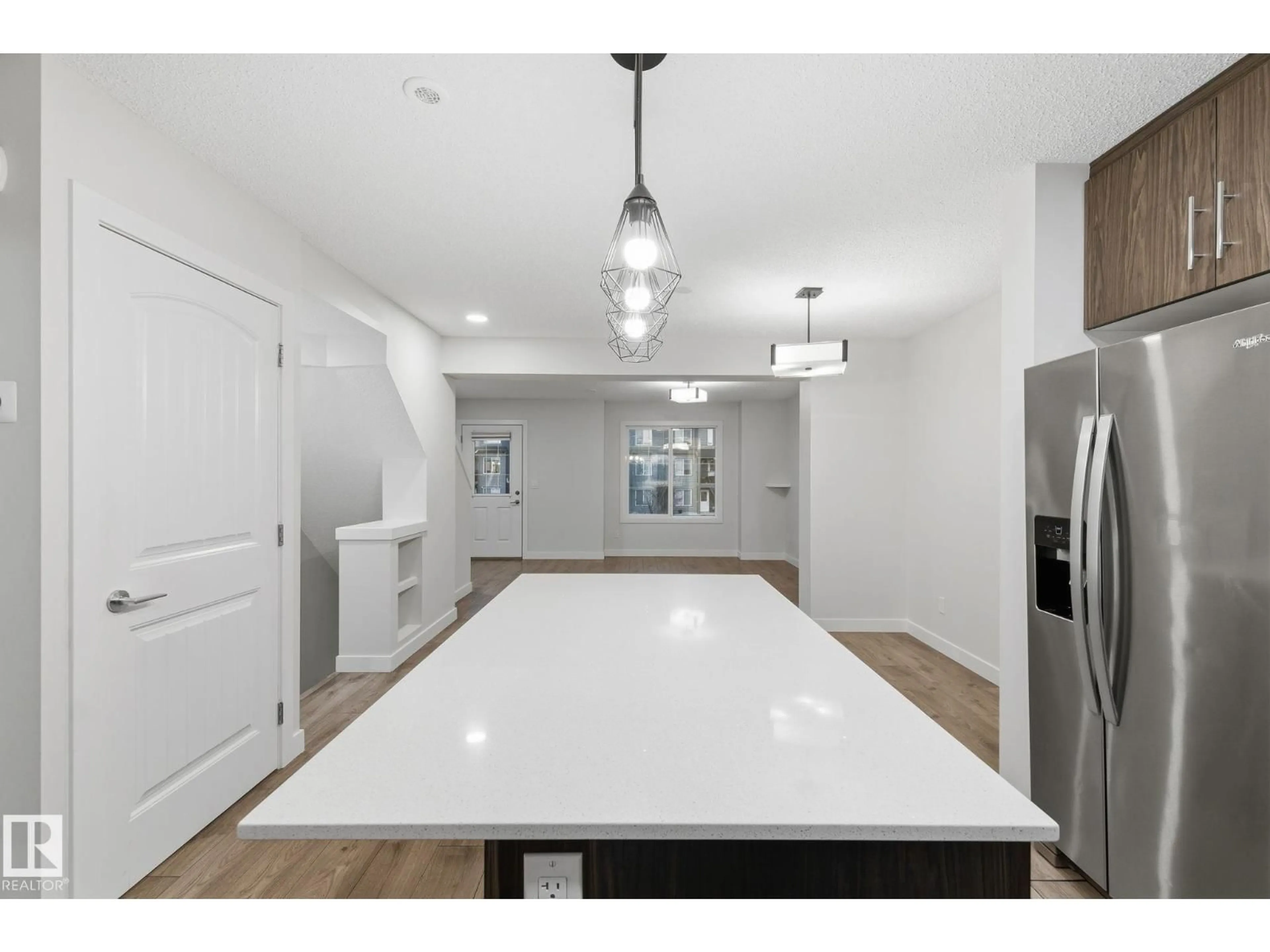 Open concept kitchen, unknown for #38 - 3025 151 AV, Edmonton Alberta T5Y3W4