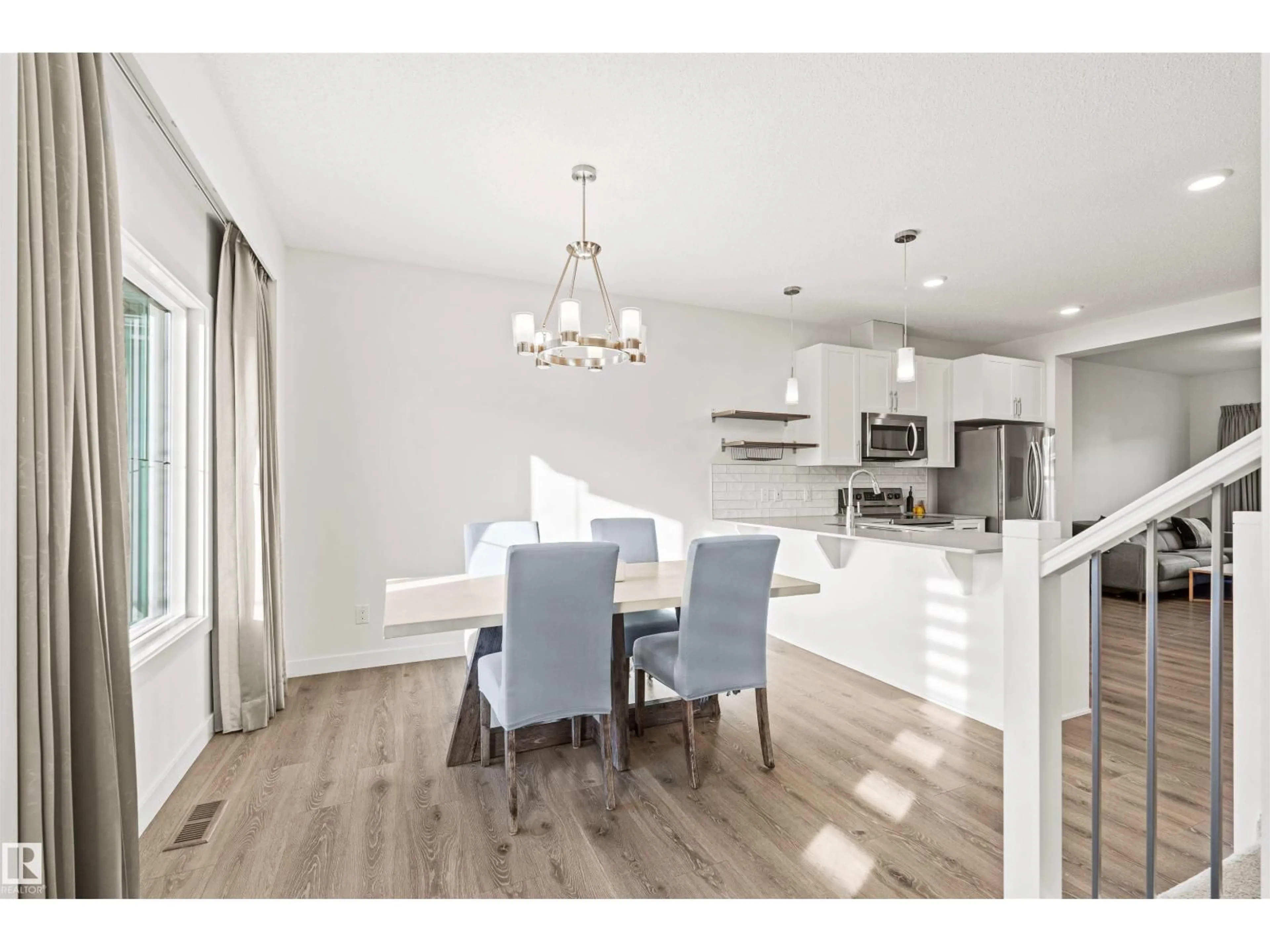 Open concept kitchen, wood/laminate floor for SW - 16618 31 AV, Edmonton Alberta T6W4P8