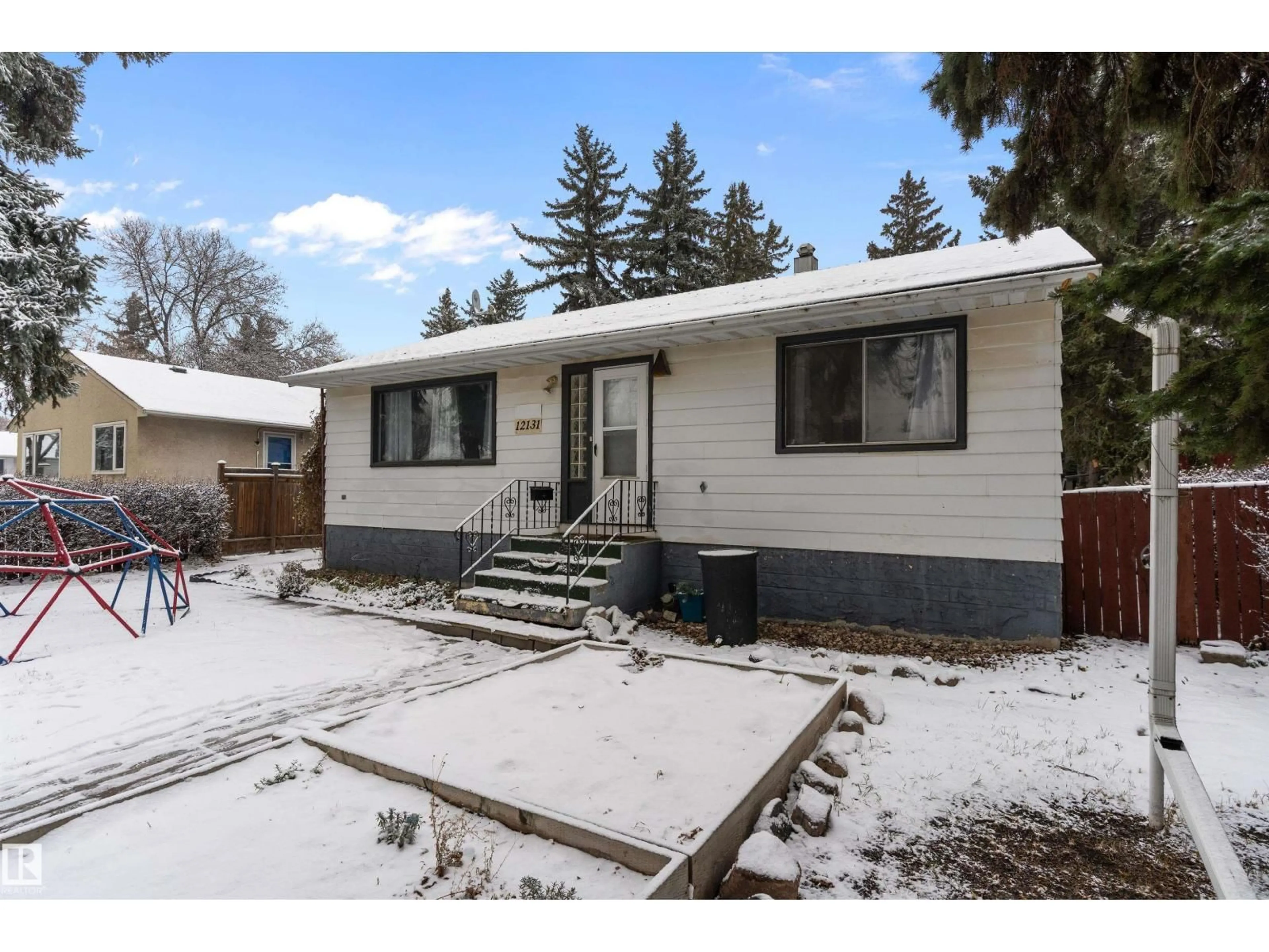 Home with vinyl exterior material, street for NW - 12131 141 ST, Edmonton Alberta T5L2G1