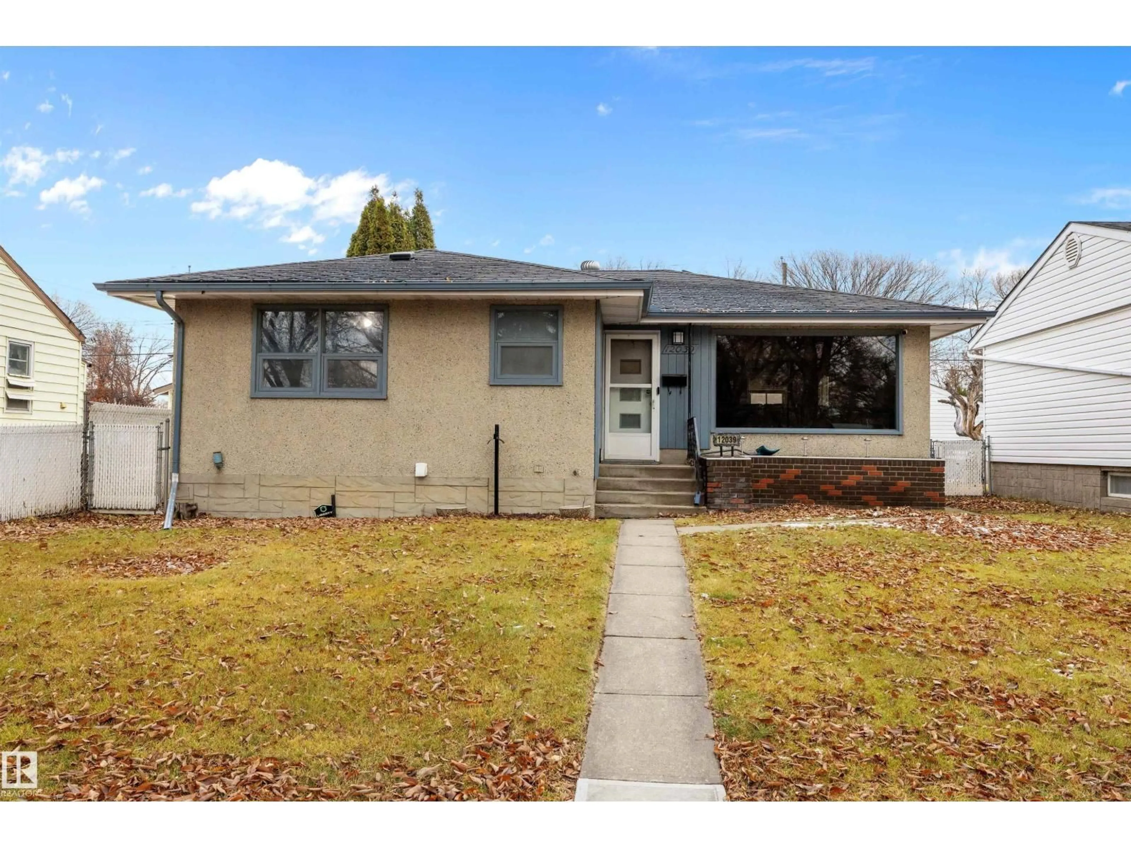 Home with vinyl exterior material, street for 12039 52 ST, Edmonton Alberta T5W3J7
