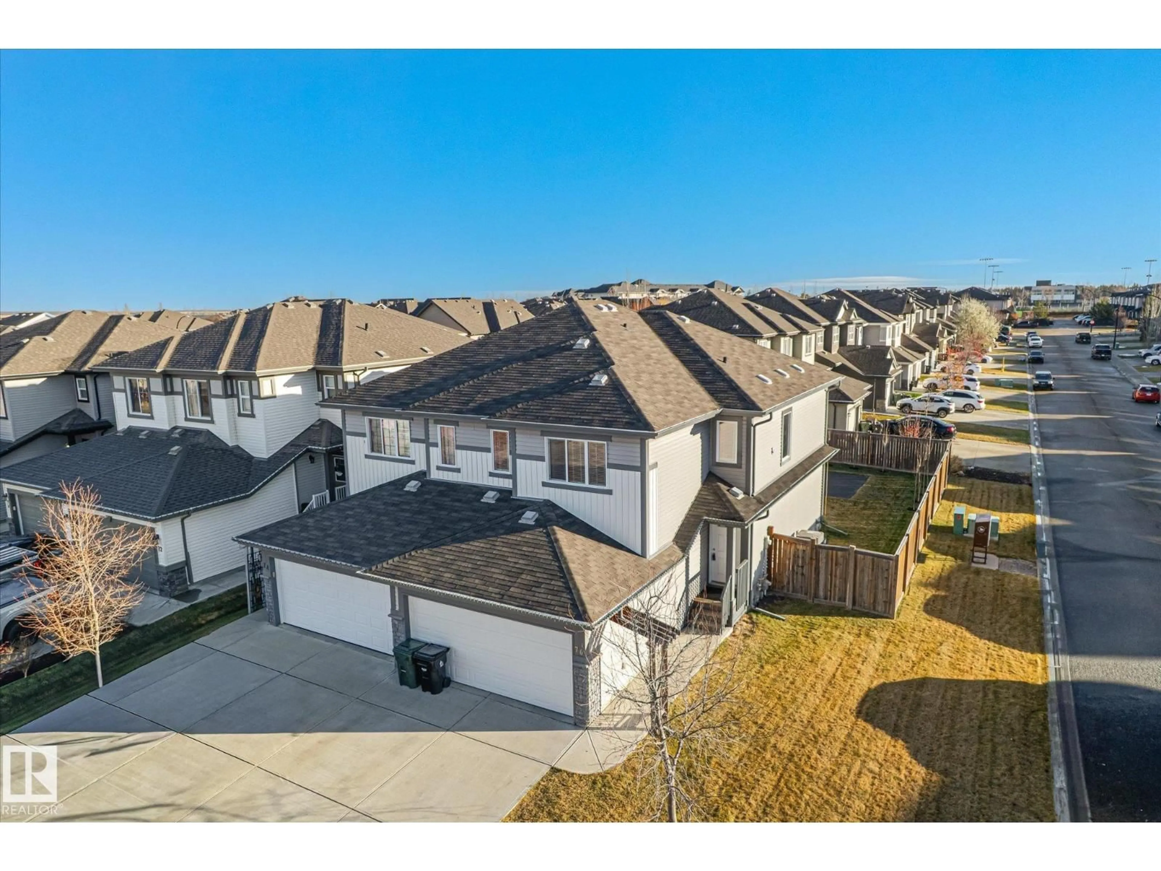 A pic from outside/outdoor area/front of a property/back of a property/a pic from drone, street for 76 SPRINGWOOD WY, Spruce Grove Alberta T7X0S8