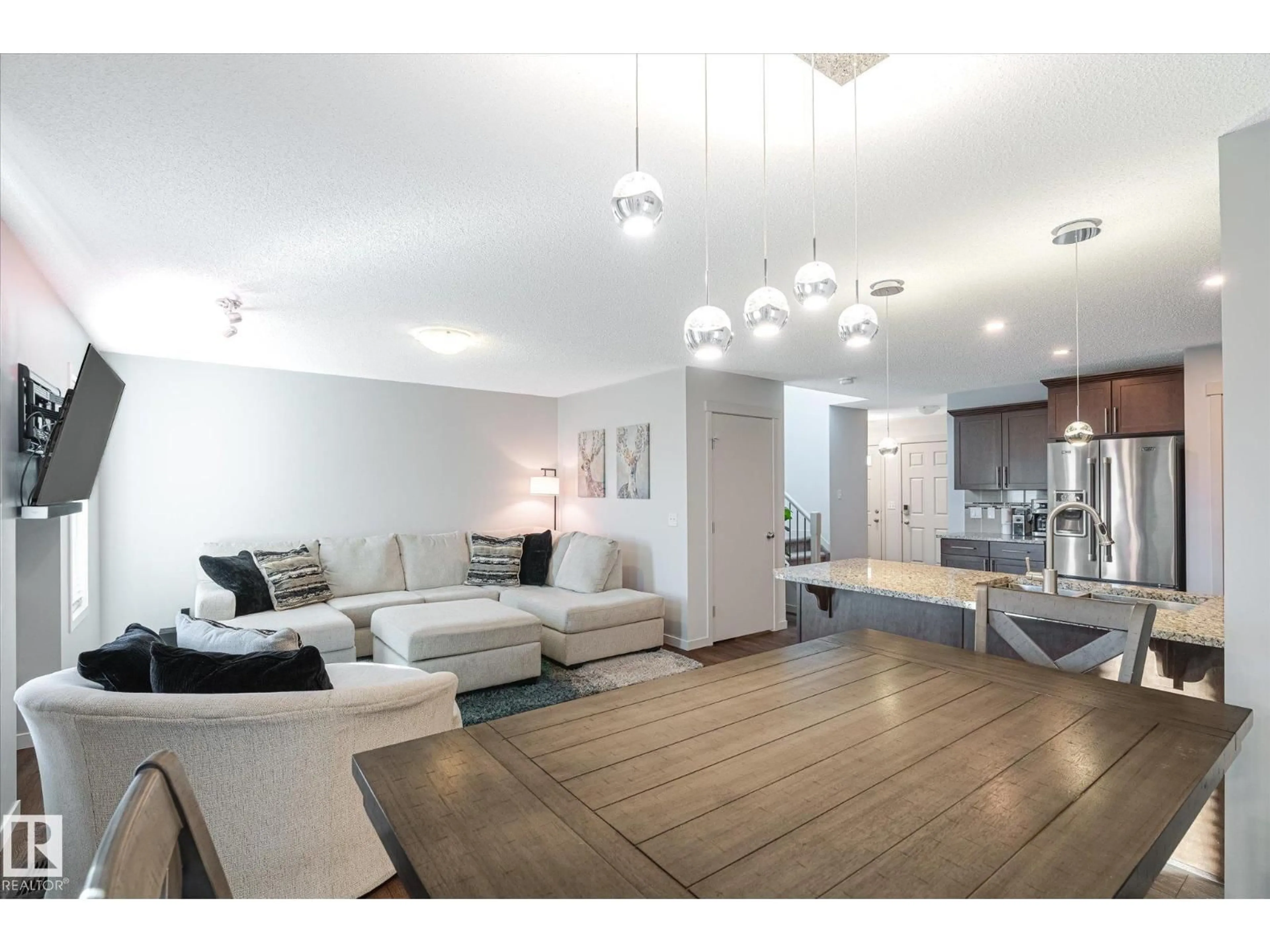 Living room with furniture, wood/laminate floor for 76 SPRINGWOOD WY, Spruce Grove Alberta T7X0S8