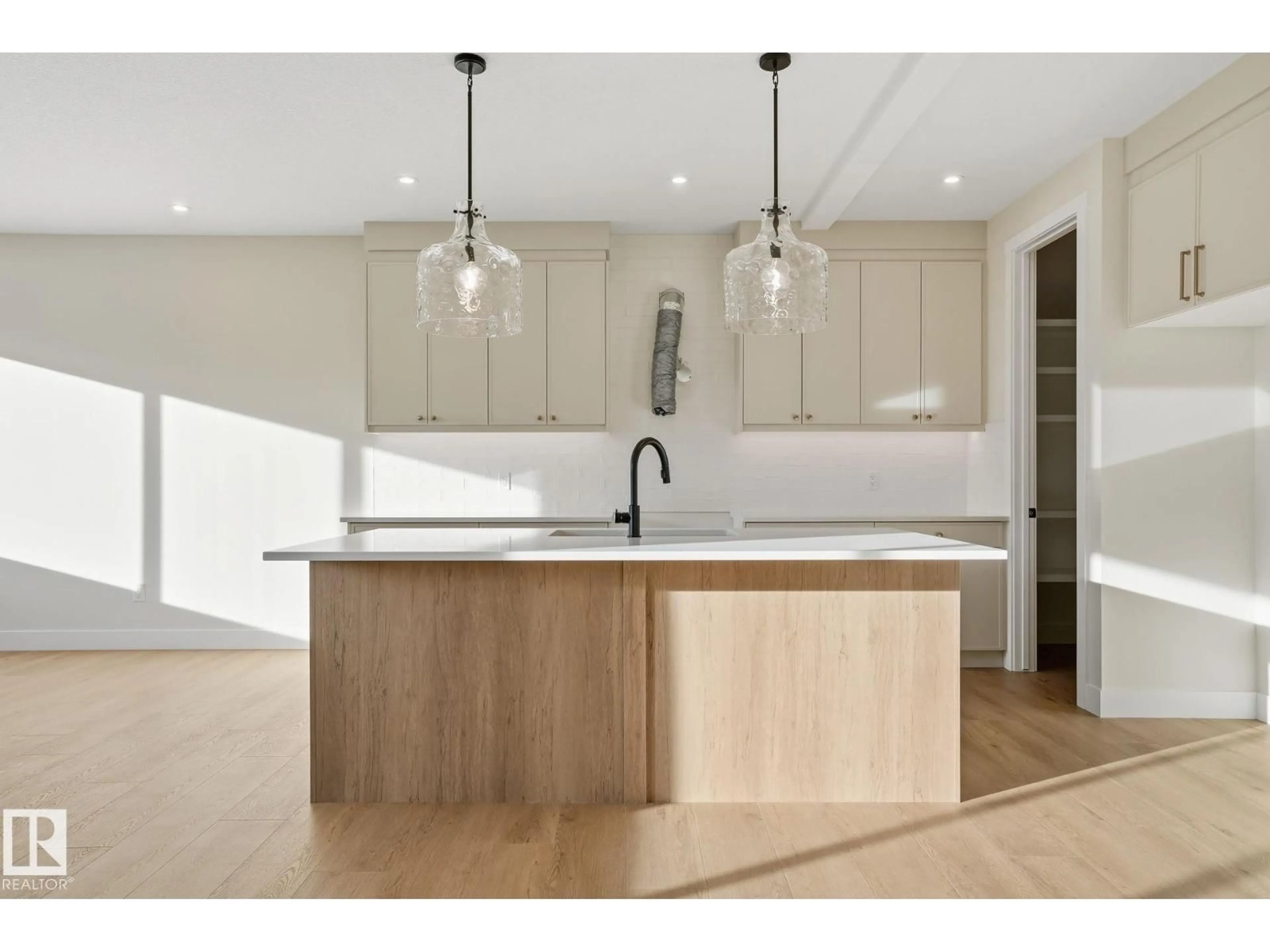 Open concept kitchen, wood/laminate floor for 721 ASTORIA WY, Devon Alberta T9G0M7