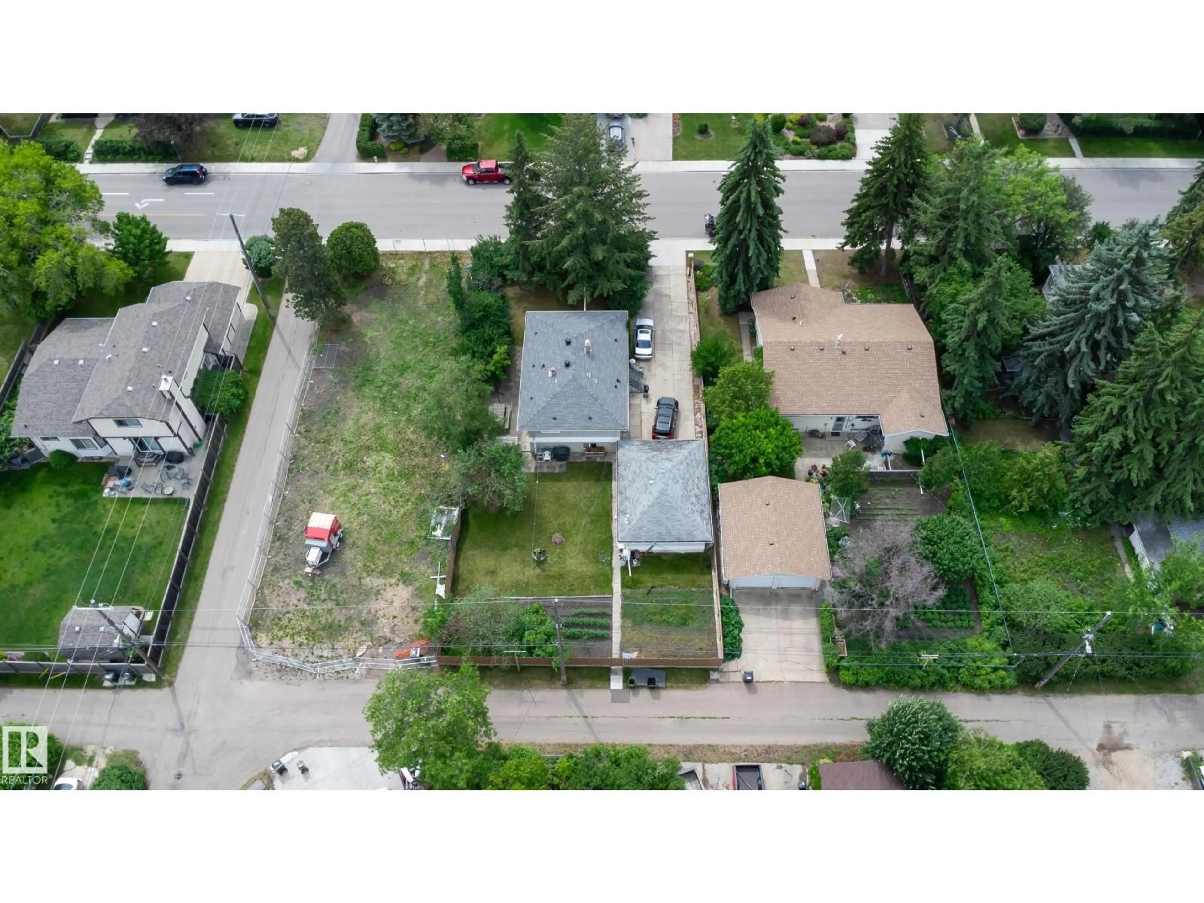 A pic from outside/outdoor area/front of a property/back of a property/a pic from drone, street for 8316 73 AV, Edmonton Alberta T6C0E2
