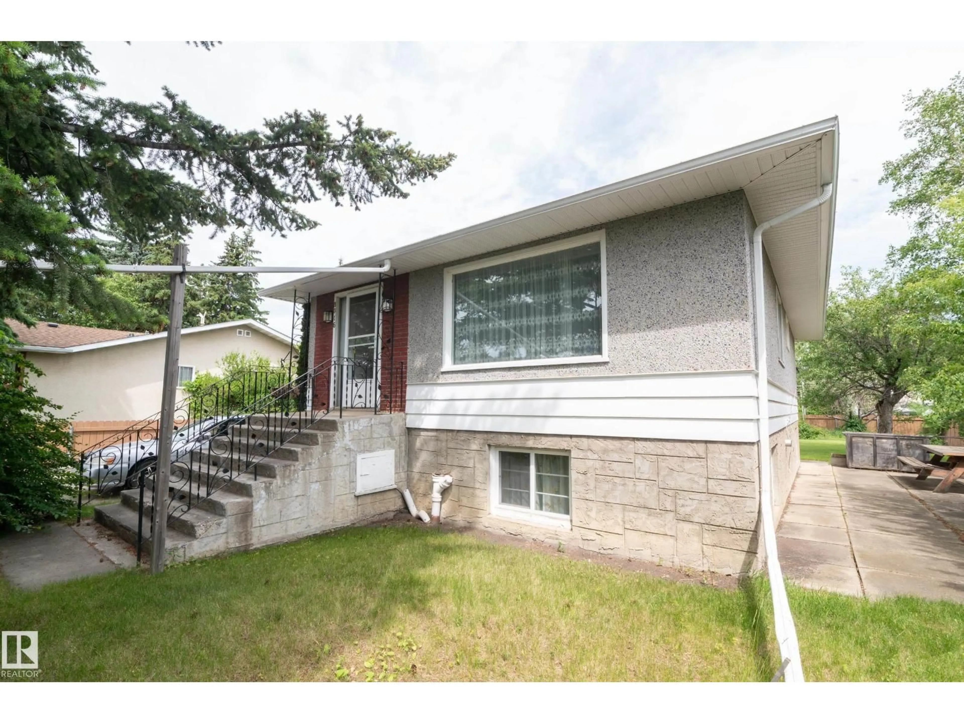 Home with vinyl exterior material, street for 8316 73 AV, Edmonton Alberta T6C0E2