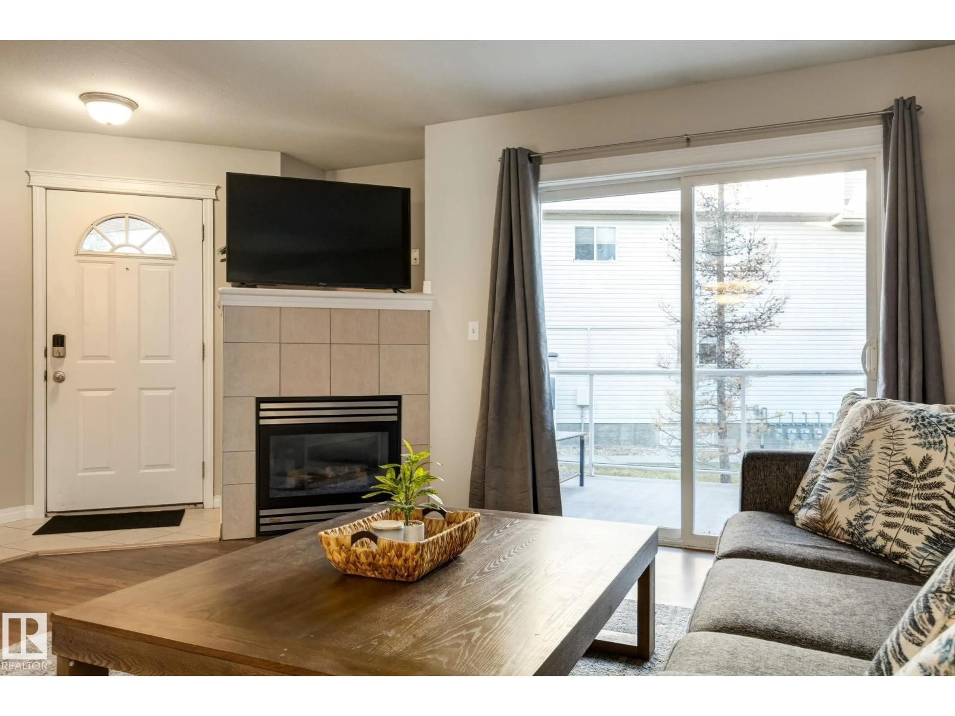 Living room with furniture, wood/laminate floor for 43 - 2505 42 ST, Edmonton Alberta T6L7G8