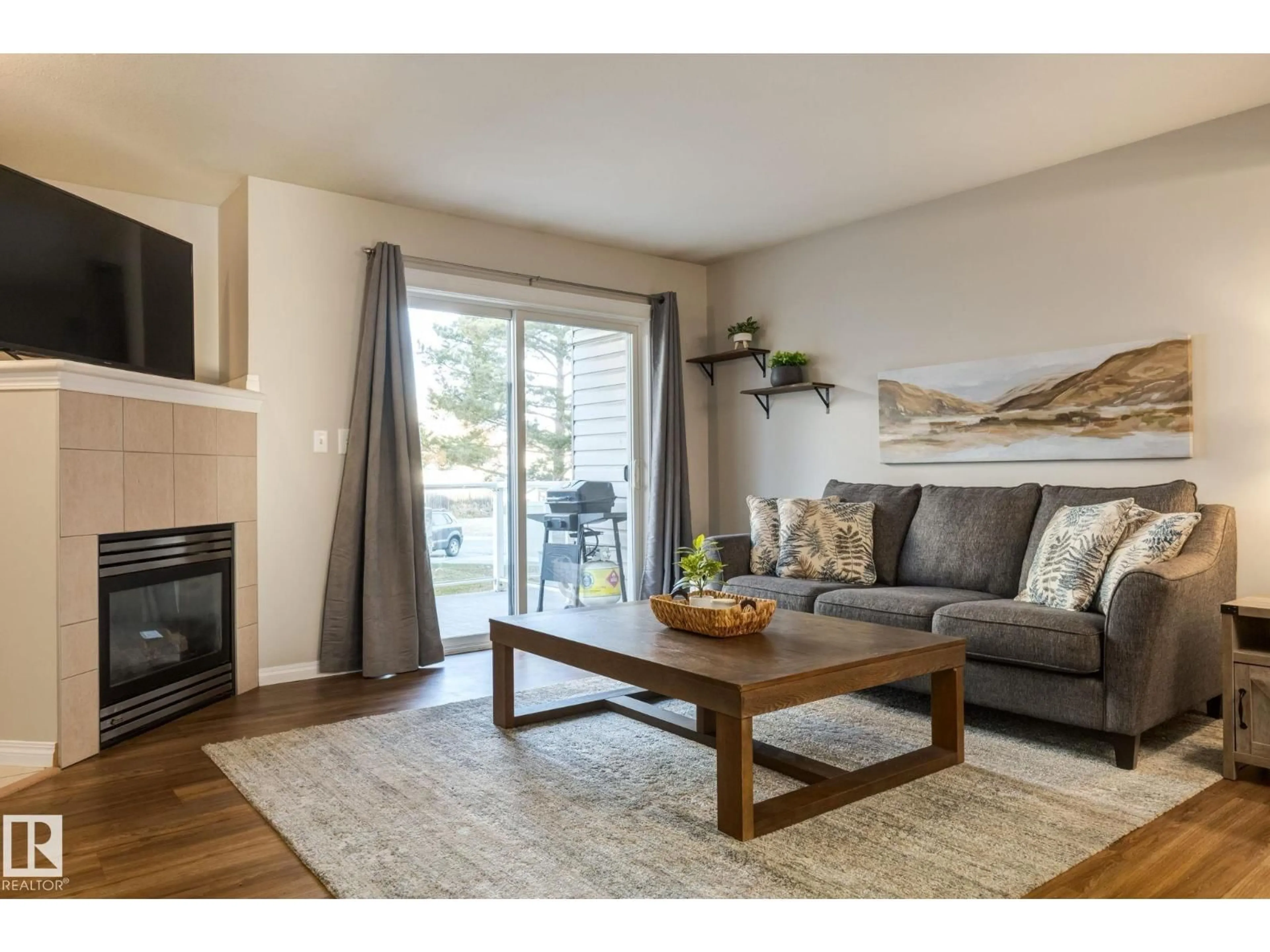 Living room with furniture, wood/laminate floor for 43 - 2505 42 ST, Edmonton Alberta T6L7G8