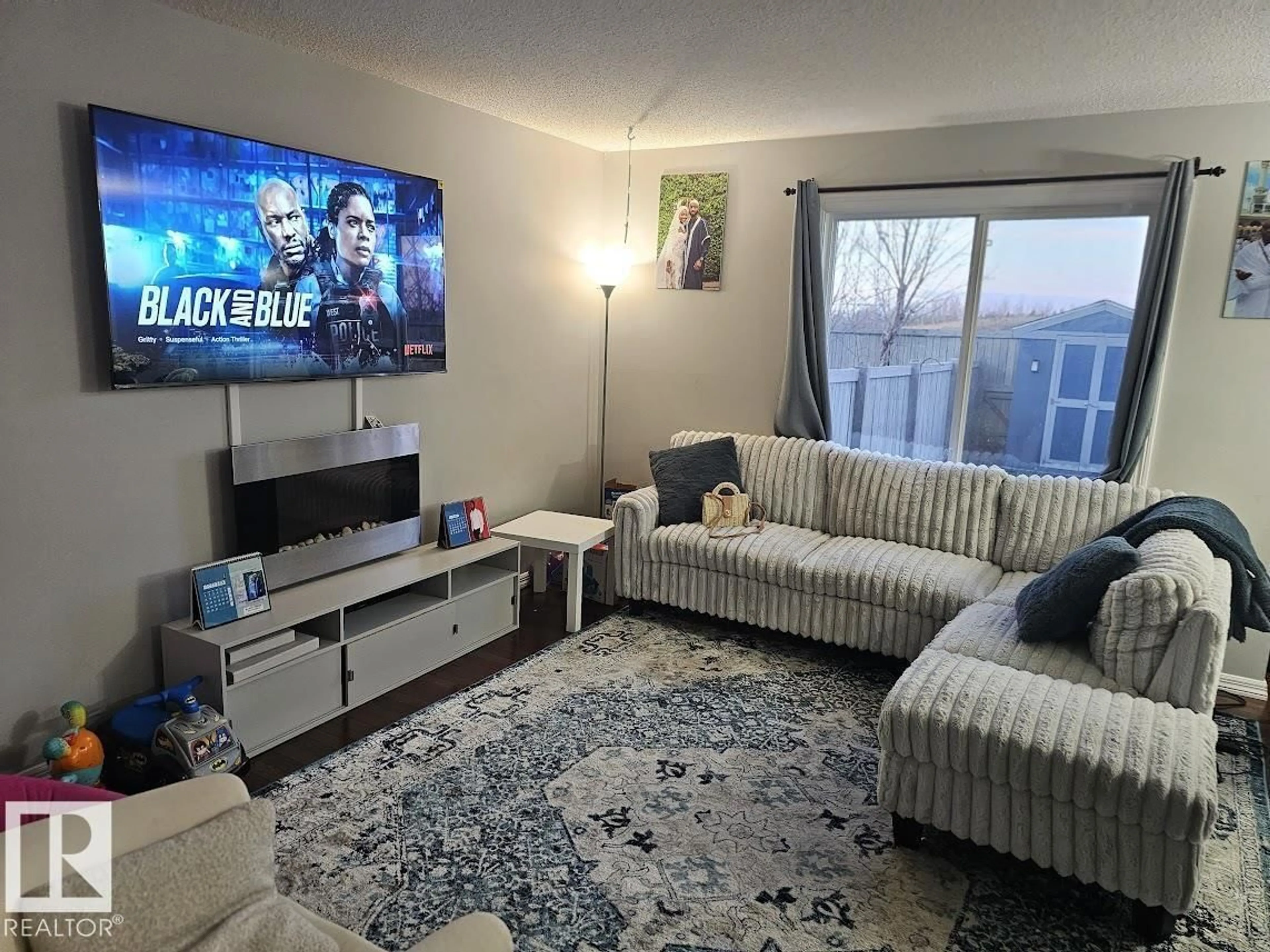 Living room with furniture, unknown for SW - 5144 1A AV, Edmonton Alberta T6X0X3