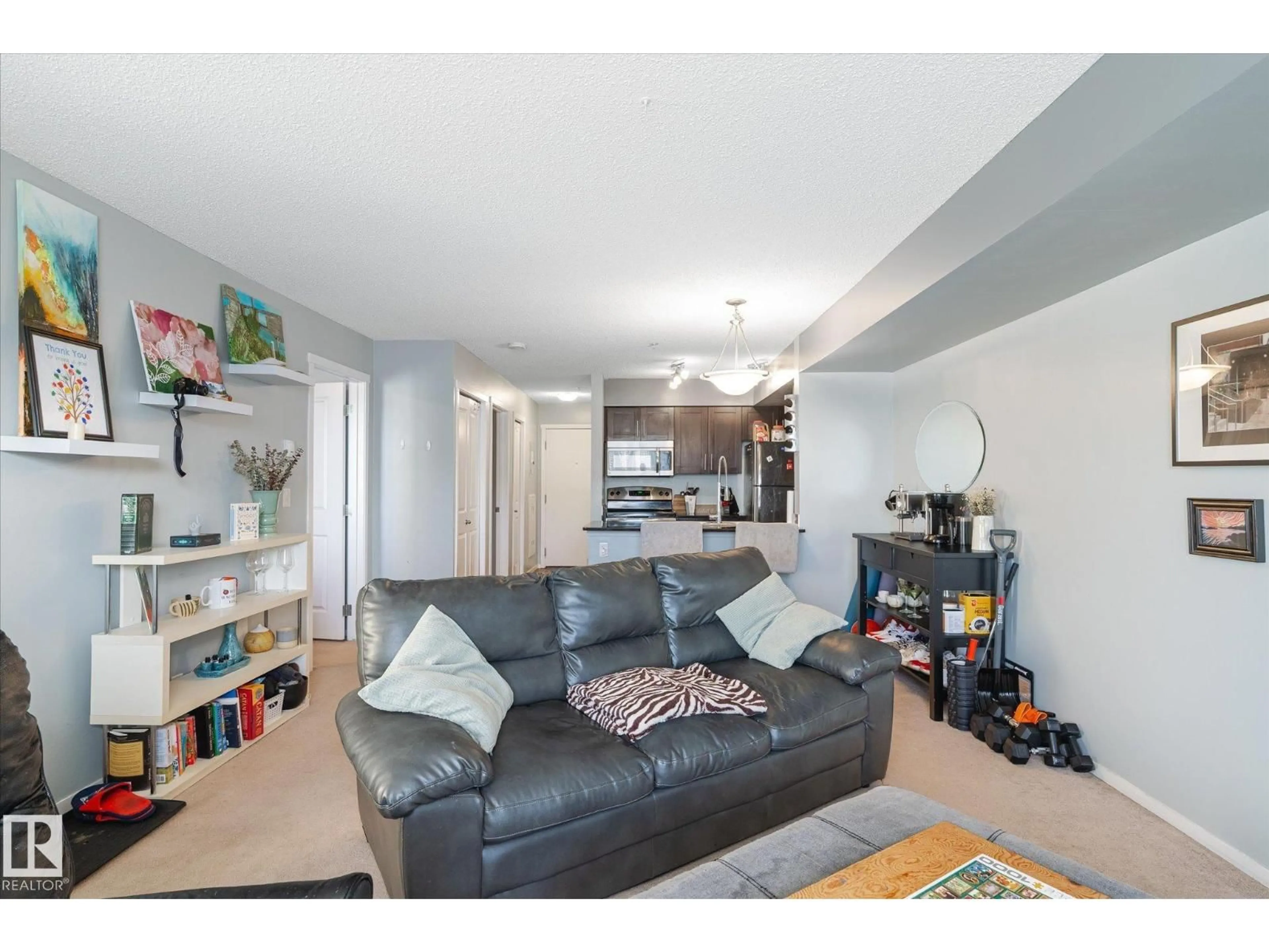 Living room with furniture, unknown for #115 - 3315 JAMES MOWATT TRAIL SW, Edmonton Alberta T6W3L9