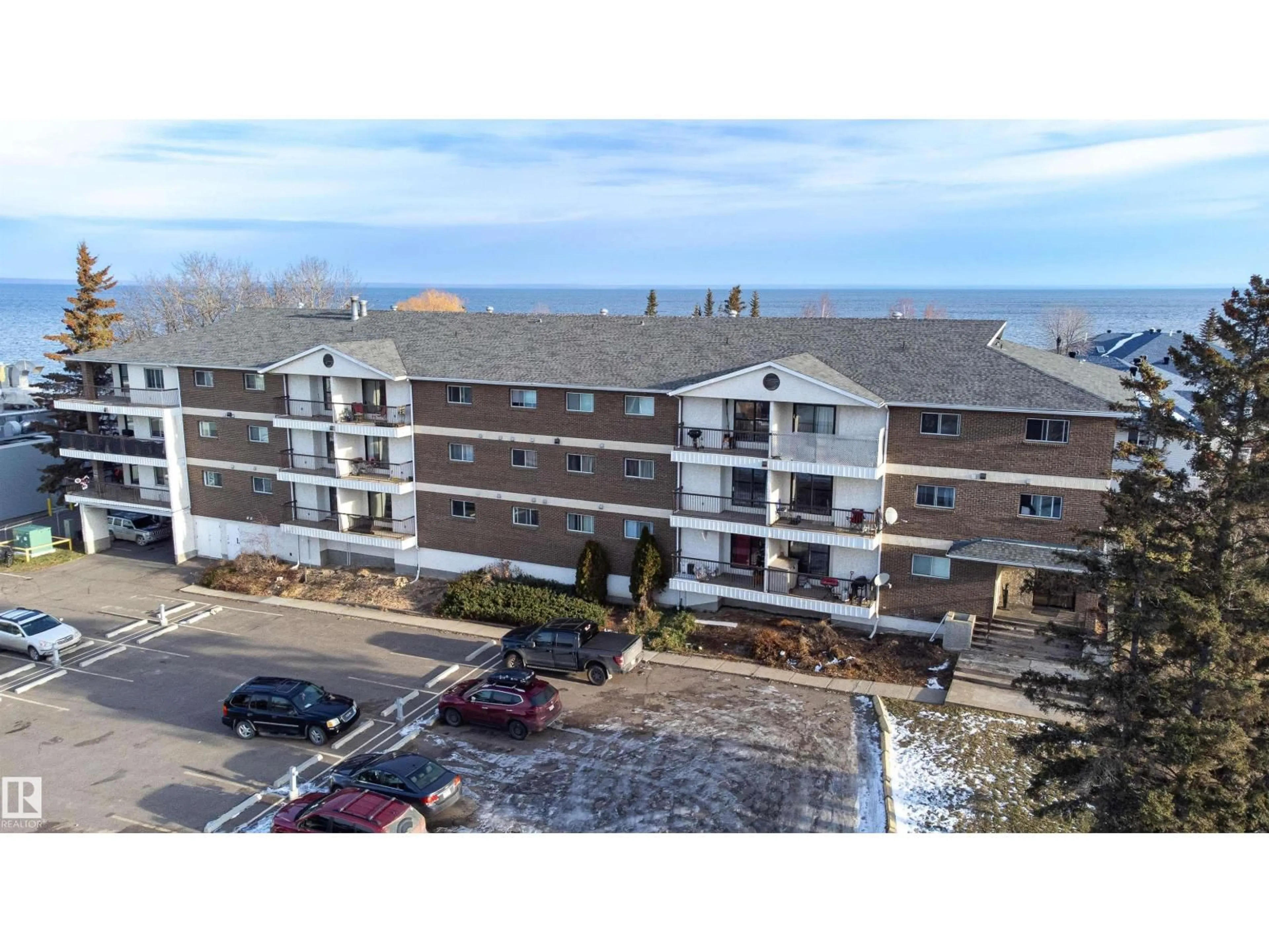 A pic from outside/outdoor area/front of a property/back of a property/a pic from drone, building for #201 - 104 10 ST, Cold Lake Alberta T9M1A6