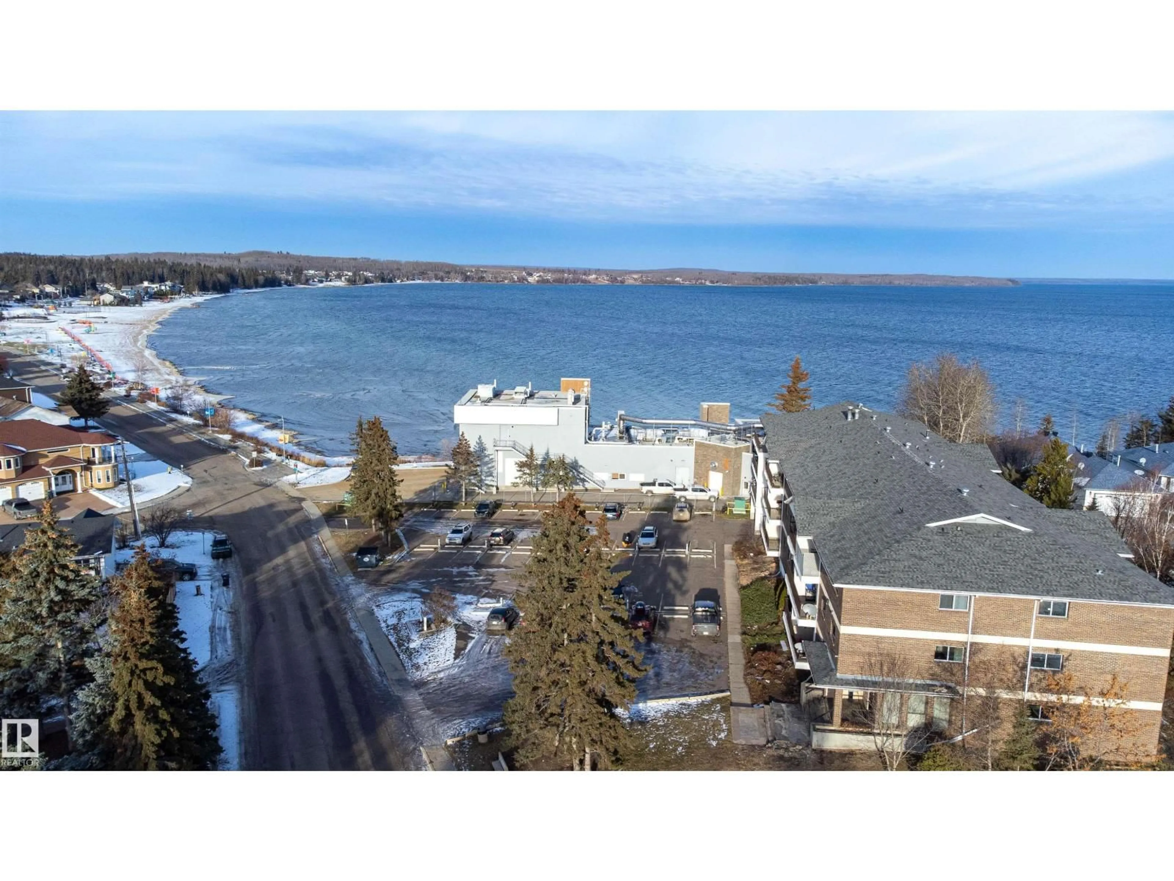 A pic from outside/outdoor area/front of a property/back of a property/a pic from drone, water/lake/river/ocean view for #201 - 104 10 ST, Cold Lake Alberta T9M1A6