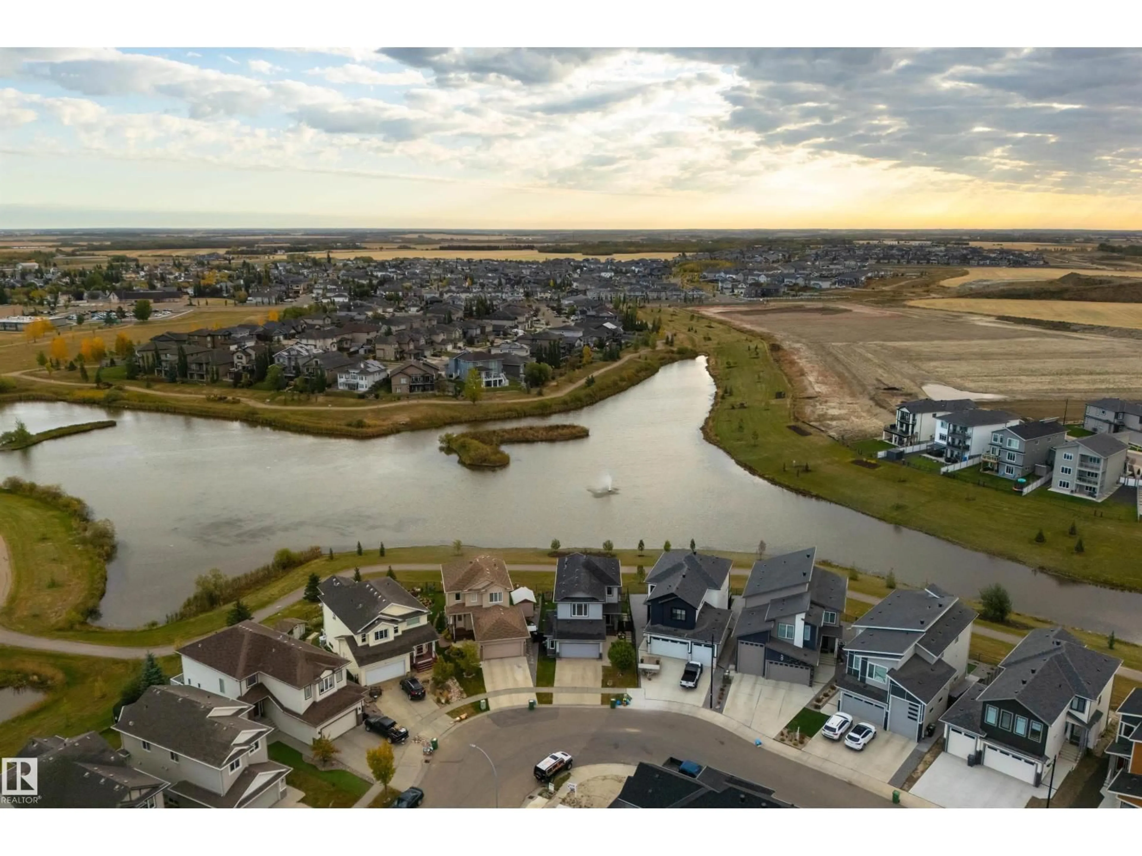 A pic from outside/outdoor area/front of a property/back of a property/a pic from drone, water/lake/river/ocean view for 63 DALQUIST BA, Leduc Alberta T9E0N5