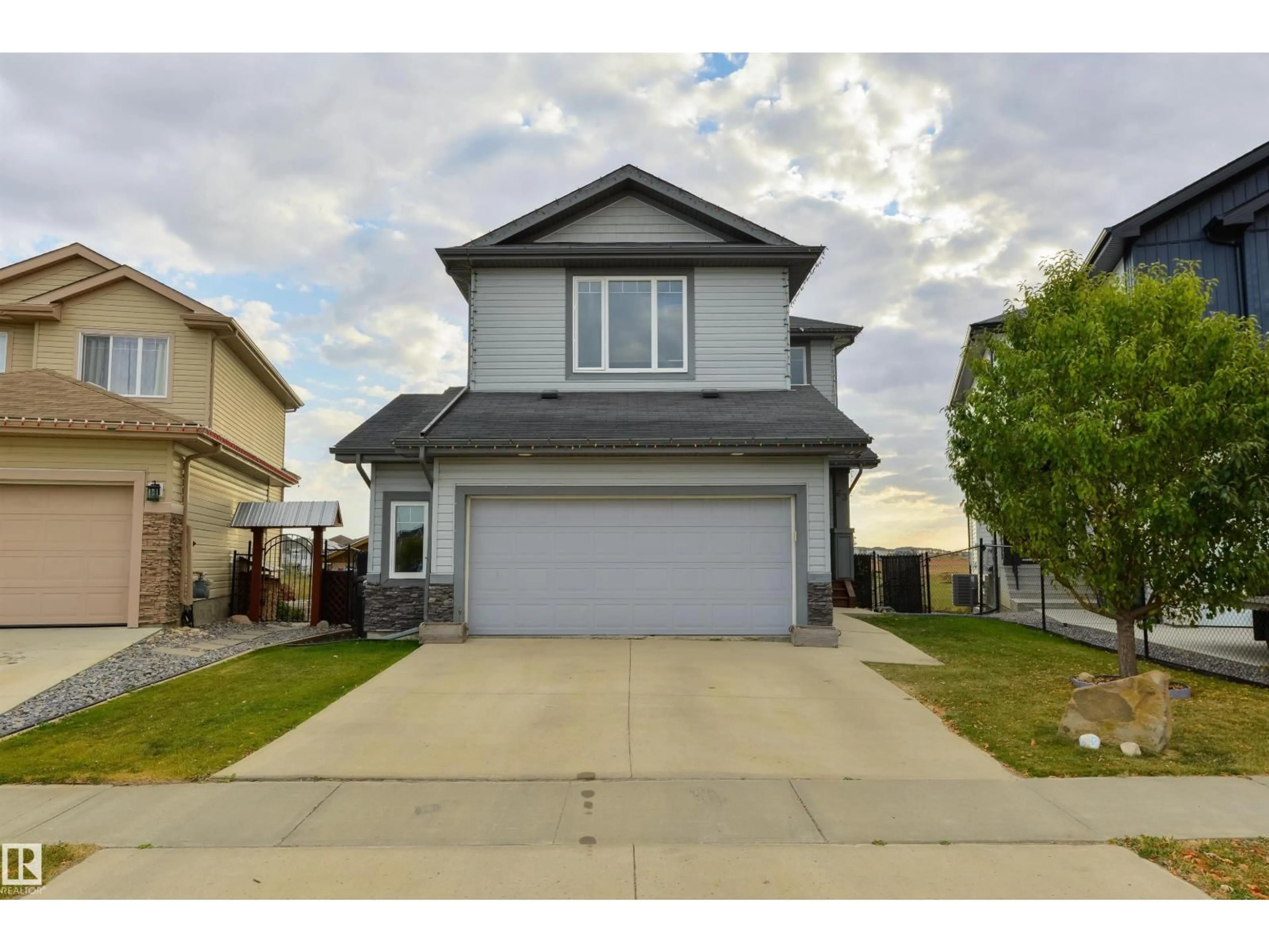 Home with vinyl exterior material, street for 63 DALQUIST BA, Leduc Alberta T9E0N5