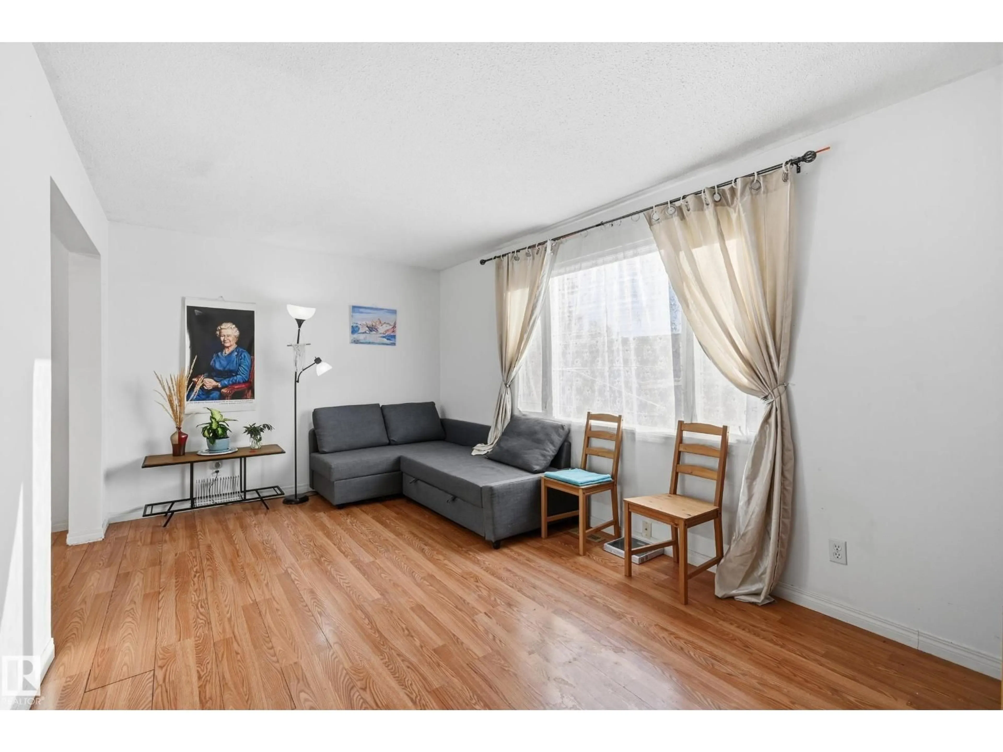 Living room with furniture, wood/laminate floor for #4 - 14310 80 ST, Edmonton Alberta T5C1L6