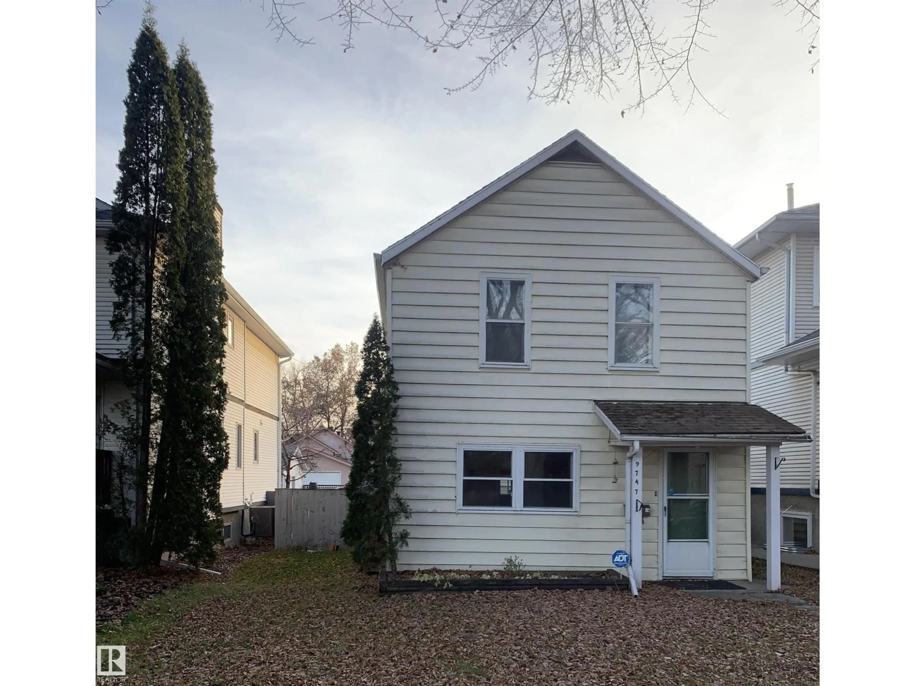 Home with vinyl exterior material, street for 9747 90 AV, Edmonton Alberta T6E2S8