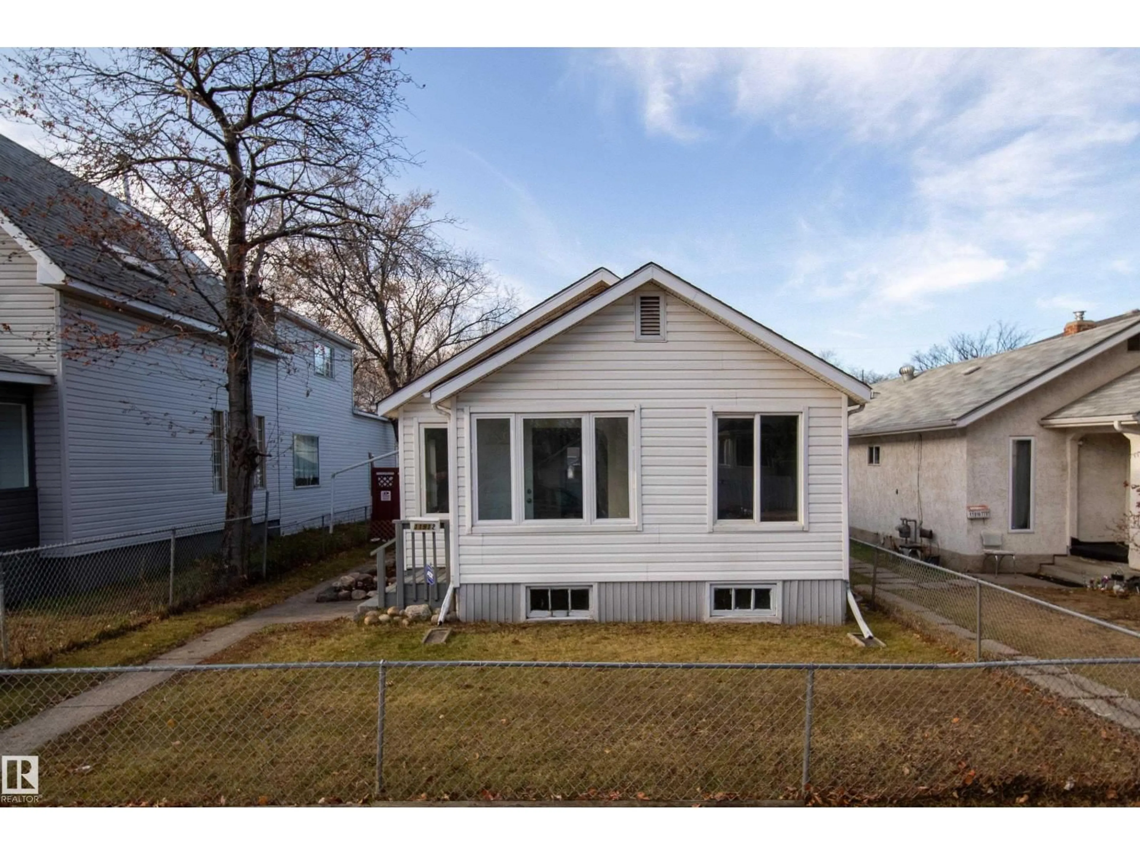 Home with vinyl exterior material, street for NW - 11912 77 ST, Edmonton Alberta T5G2B4