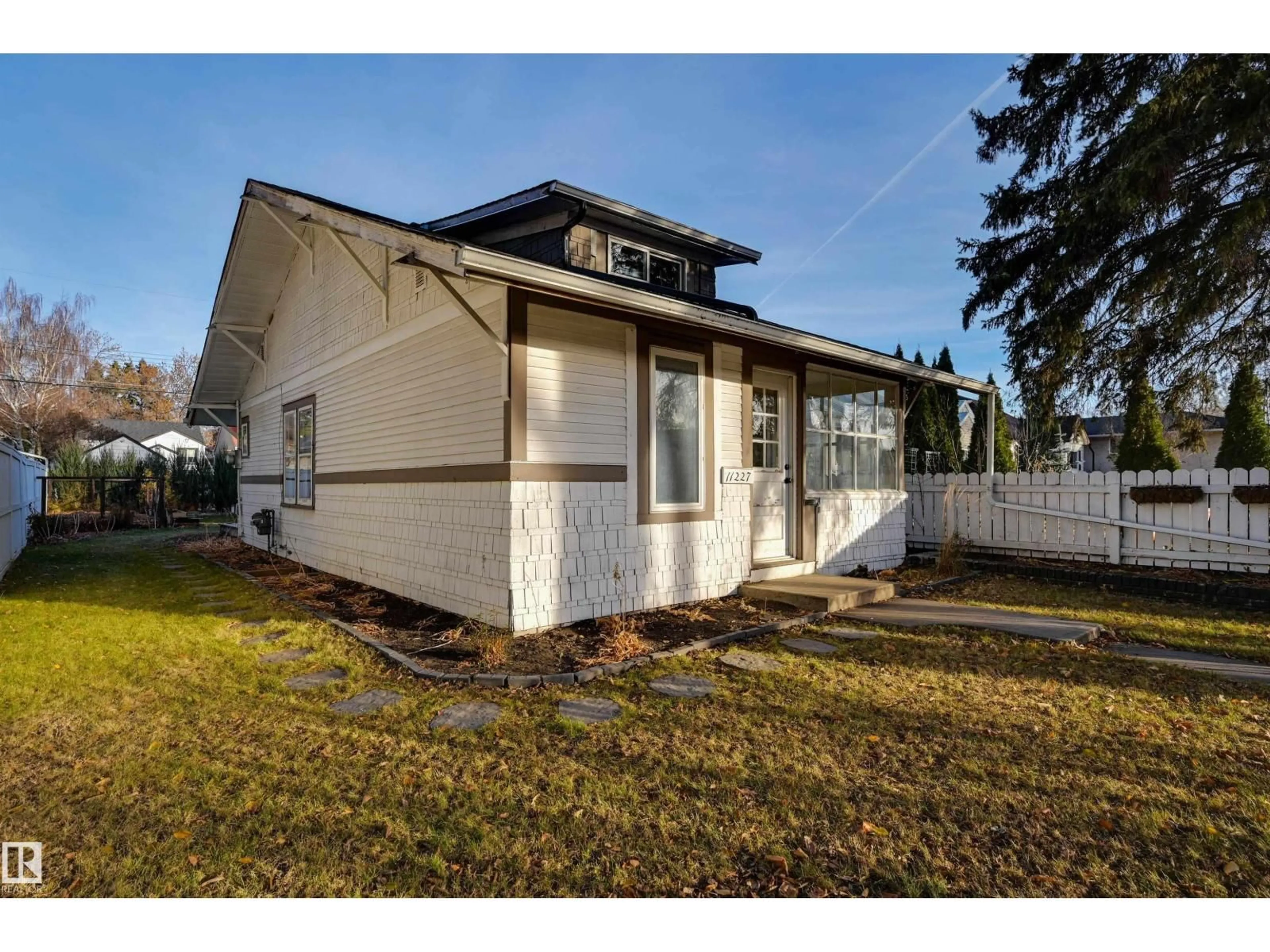 Home with vinyl exterior material, street for NW - 11227 69 ST, Edmonton Alberta T5B1R6