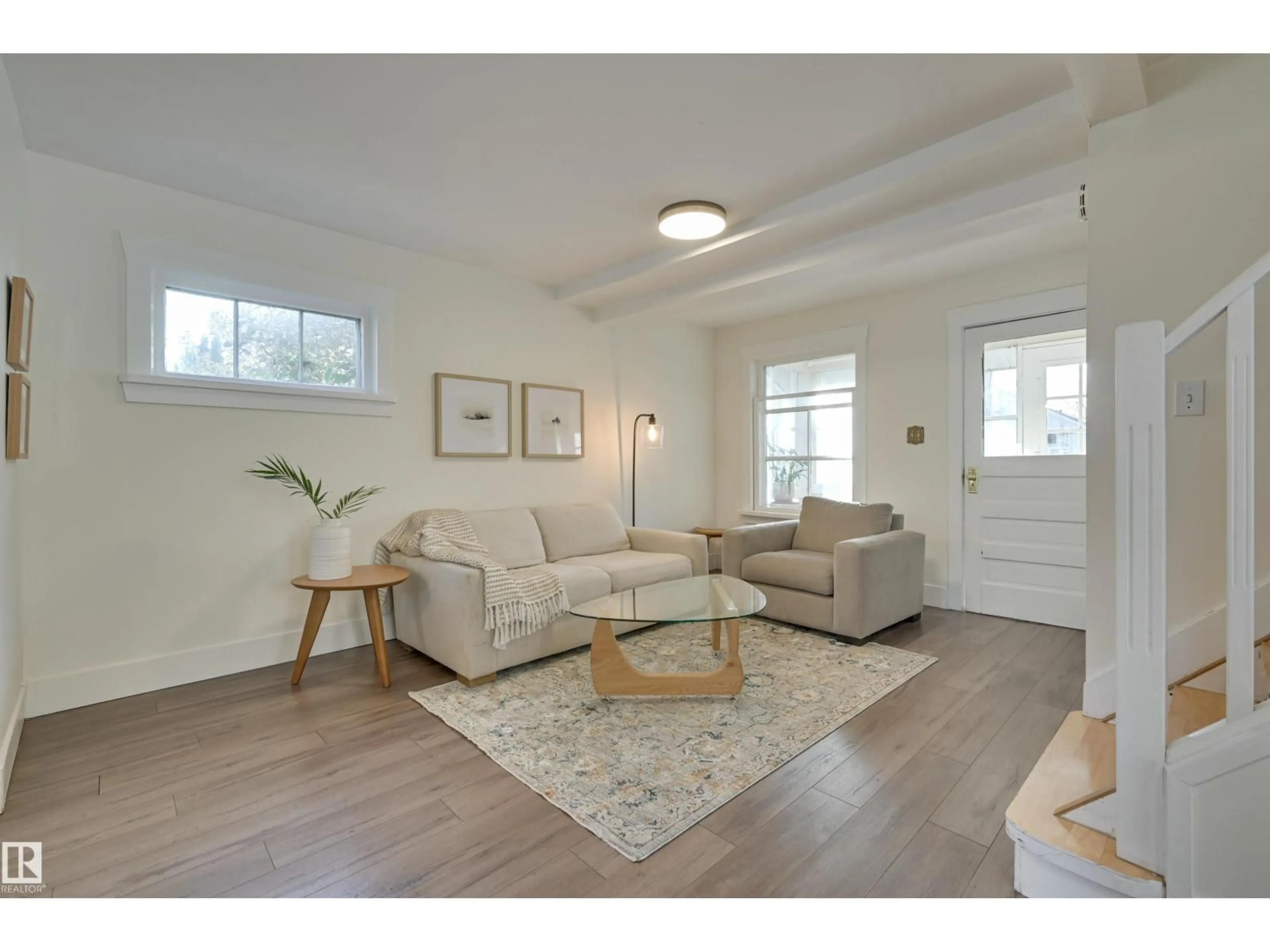 Living room with furniture, wood/laminate floor for NW - 11227 69 ST, Edmonton Alberta T5B1R6