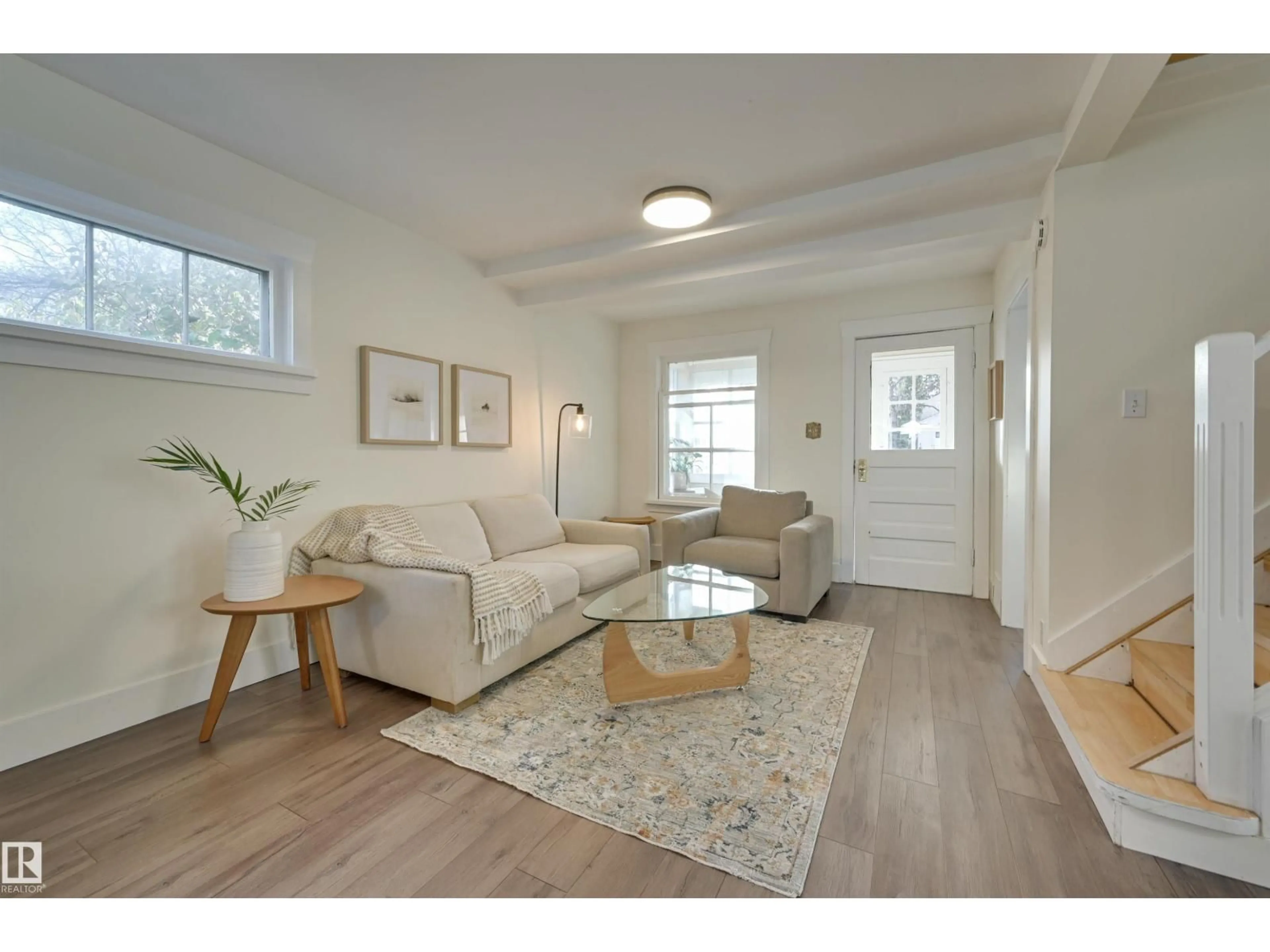 Living room with furniture, wood/laminate floor for NW - 11227 69 ST, Edmonton Alberta T5B1R6