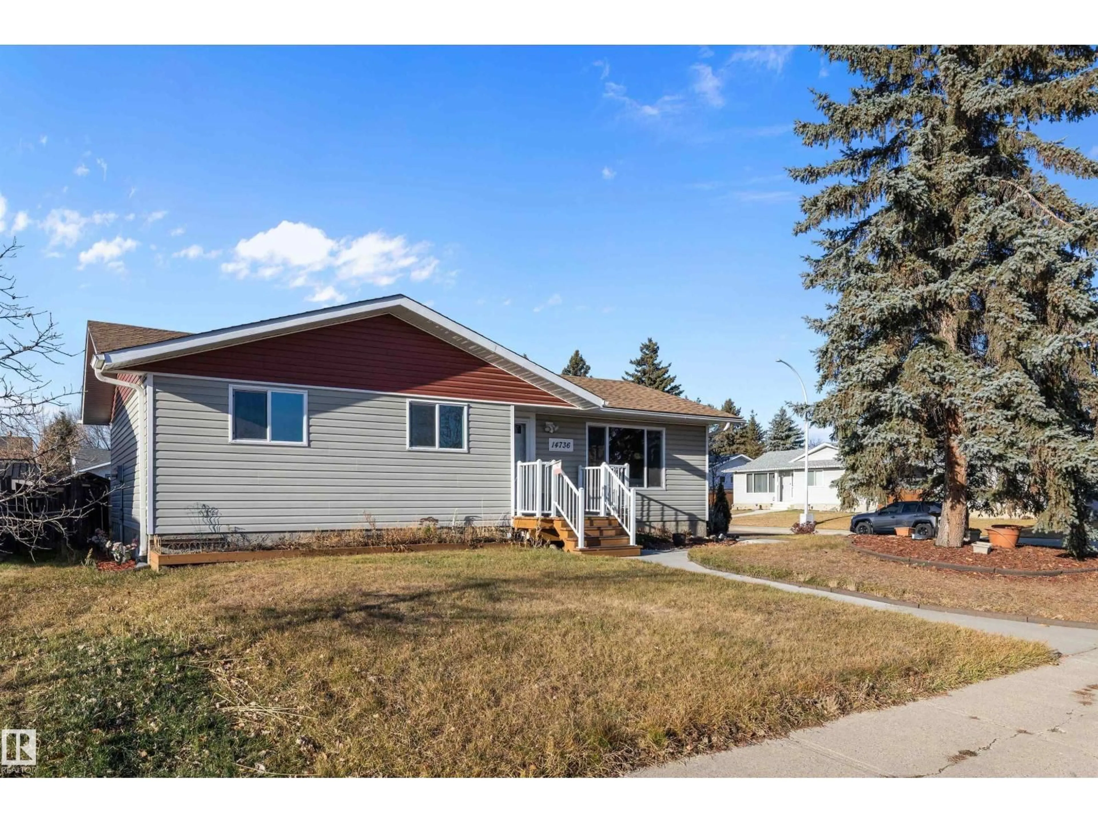 Home with vinyl exterior material, street for NW - 14736 122 ST, Edmonton Alberta T5X1V9