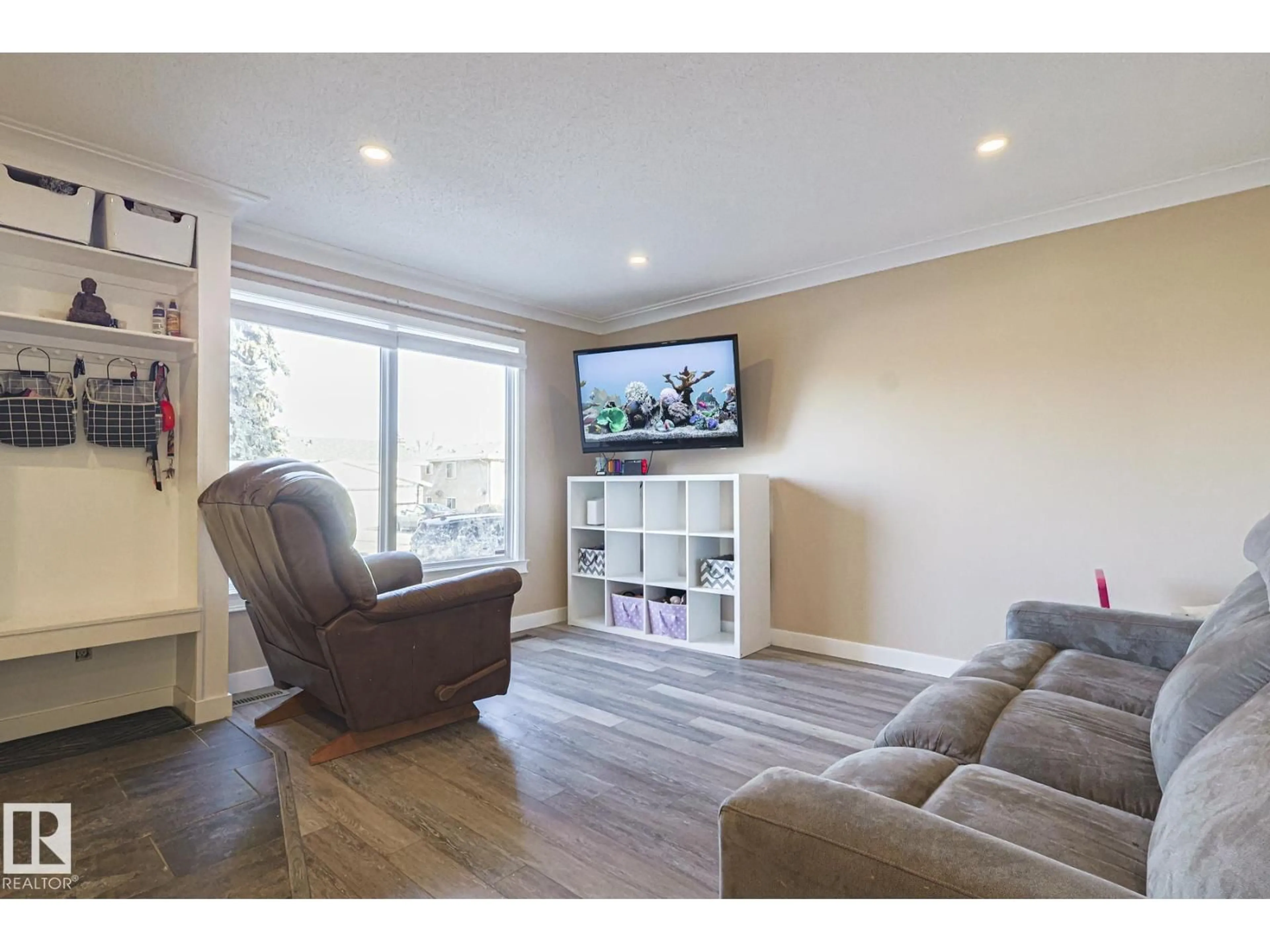 Living room with furniture, wood/laminate floor for 4211 30 AV, Edmonton Alberta T6L4P1