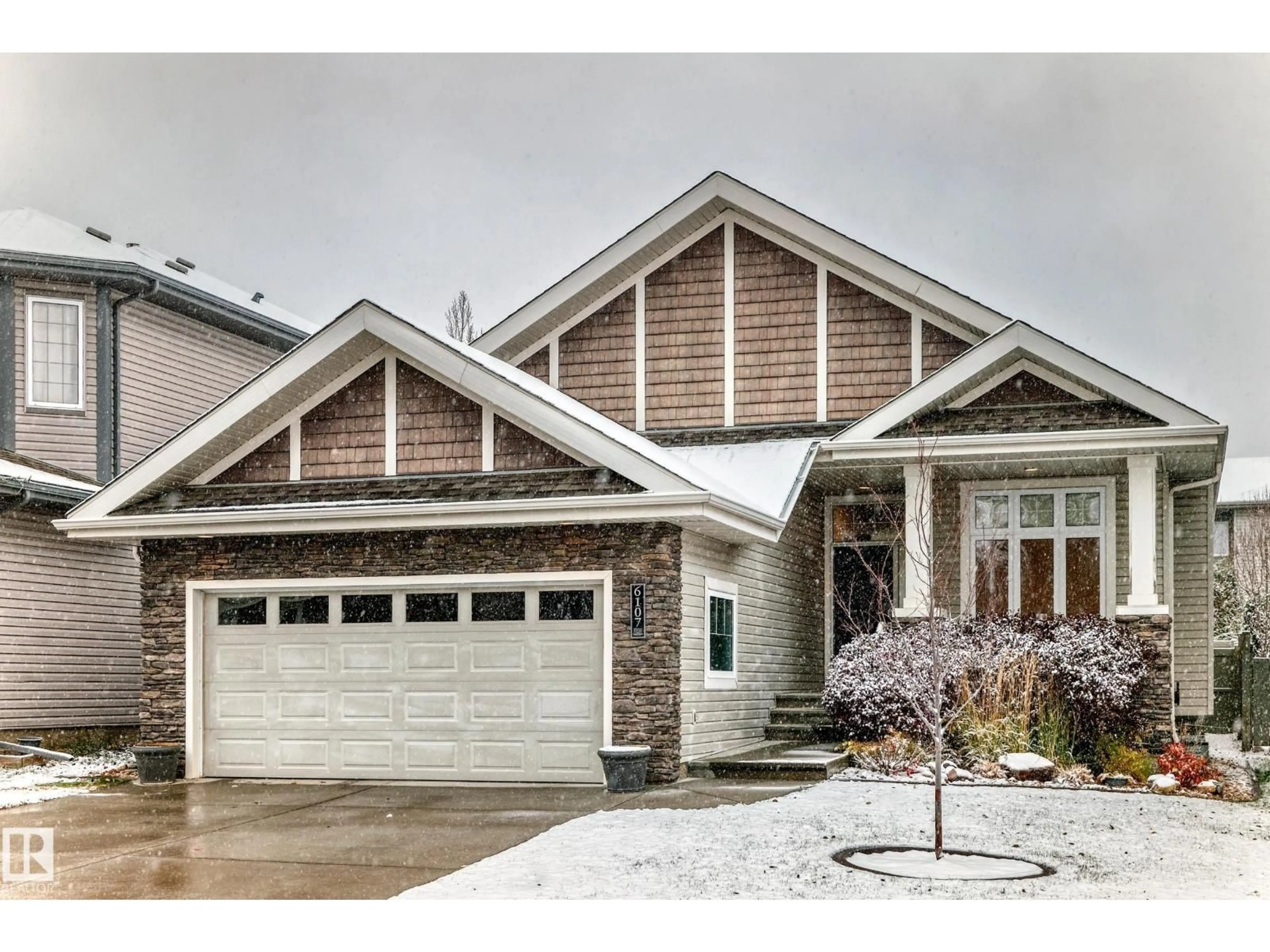 Home with vinyl exterior material, street for 6107 MAYNARD CR, Edmonton Alberta T6R0J2
