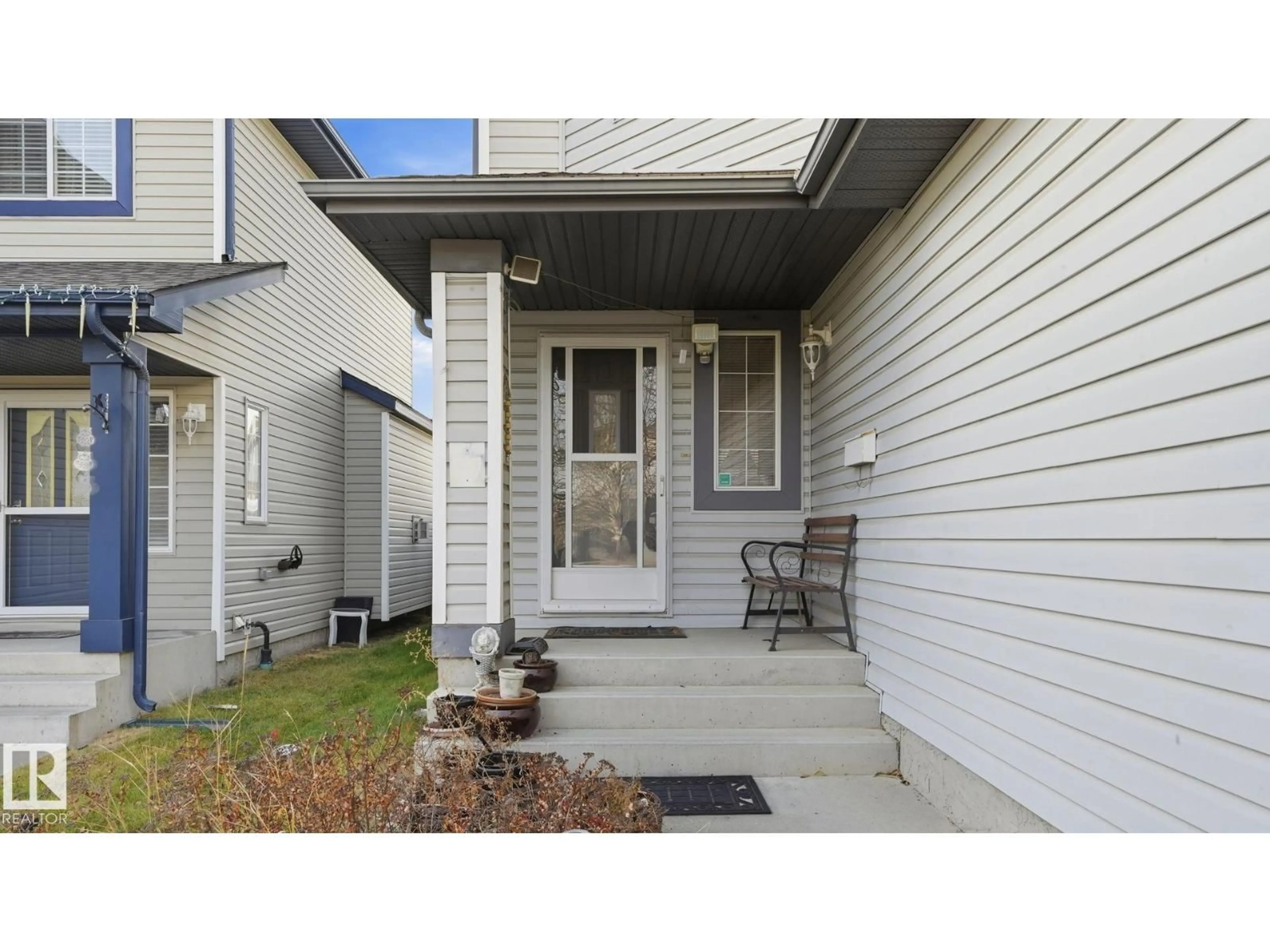 Home with vinyl exterior material, street for NW - 4712 201 ST, Edmonton Alberta T6M2X7