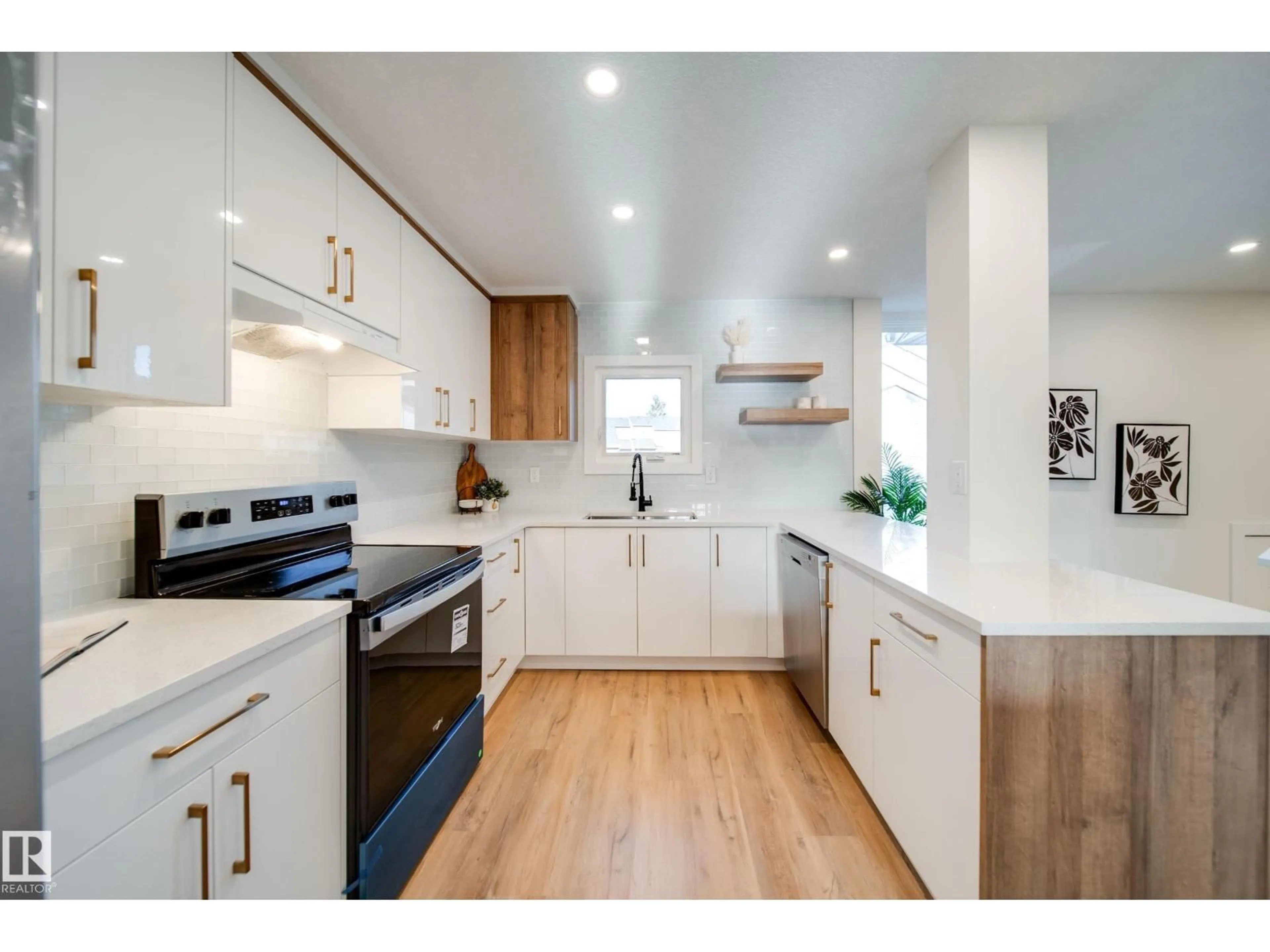 Open concept kitchen, wood/laminate floor for 5394 38A AV, Edmonton Alberta T6L2H4