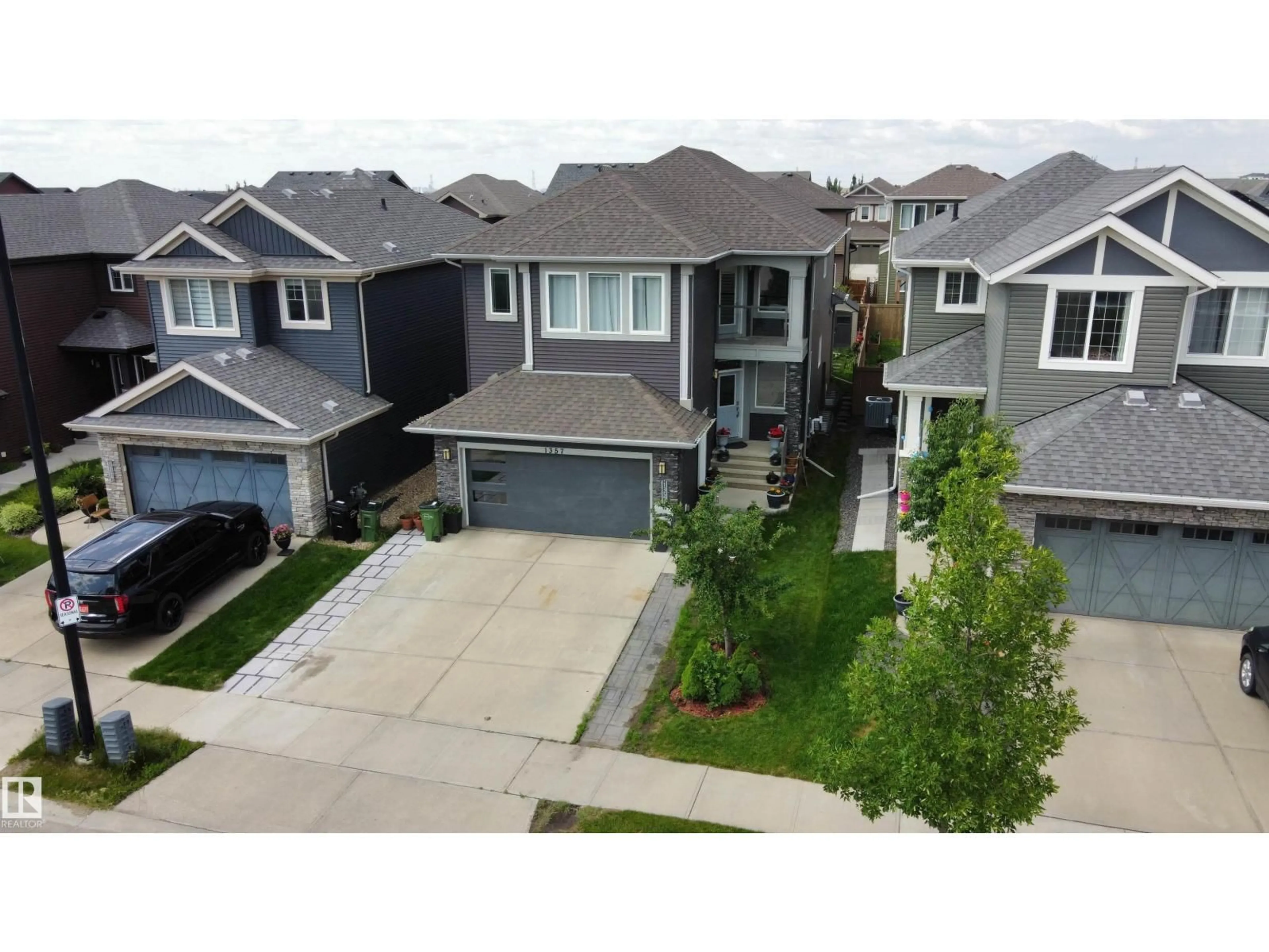 A pic from outside/outdoor area/front of a property/back of a property/a pic from drone, street for 1357 WATT DR, Edmonton Alberta T6X2A6
