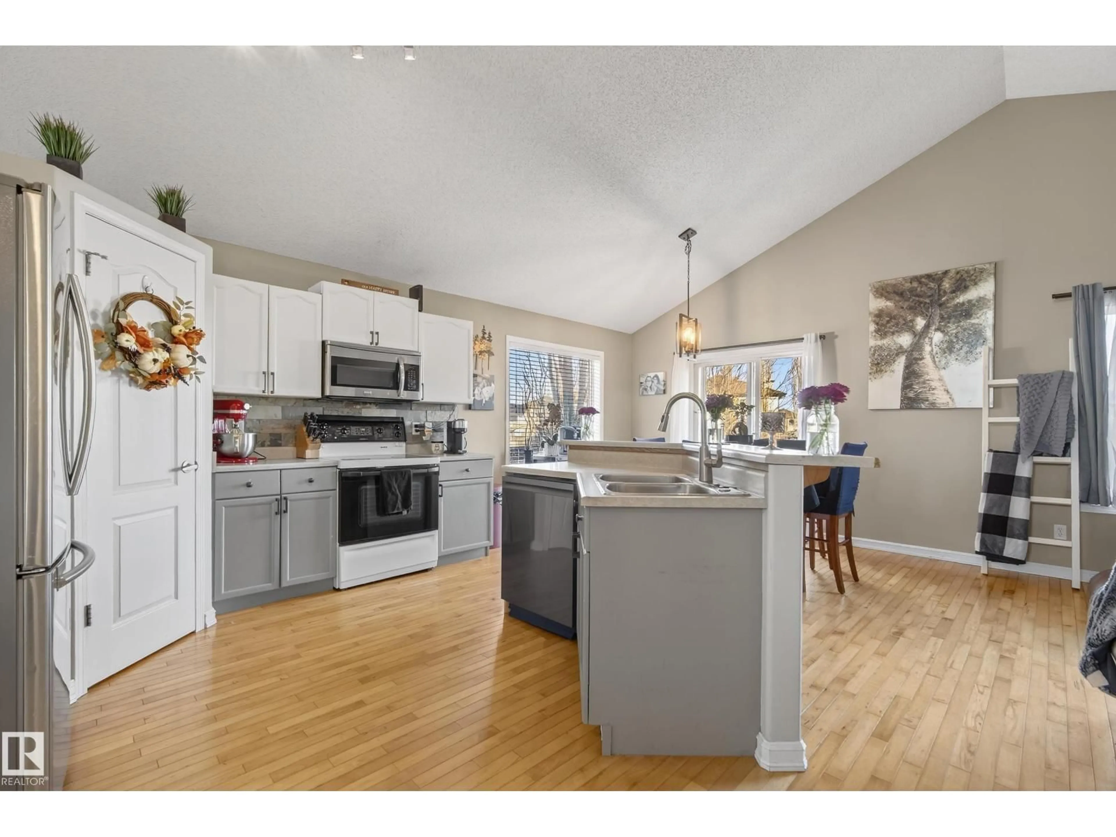 Open concept kitchen, wood/laminate floor for 3203 49 ST, Beaumont Alberta T4X1R6